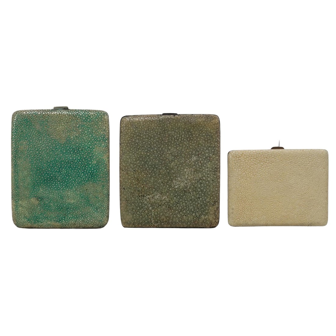 (3 pcs) Antique Shagreen Compacts: (3 pcs) Antique Shagreen CompactsEarly 20th century, EnglishA set of three antique shagreen covered gold wash compacts.(1) HC Freeman Ltd. compact. Marked inside "HCFLd. Made in England".(1) Silver co