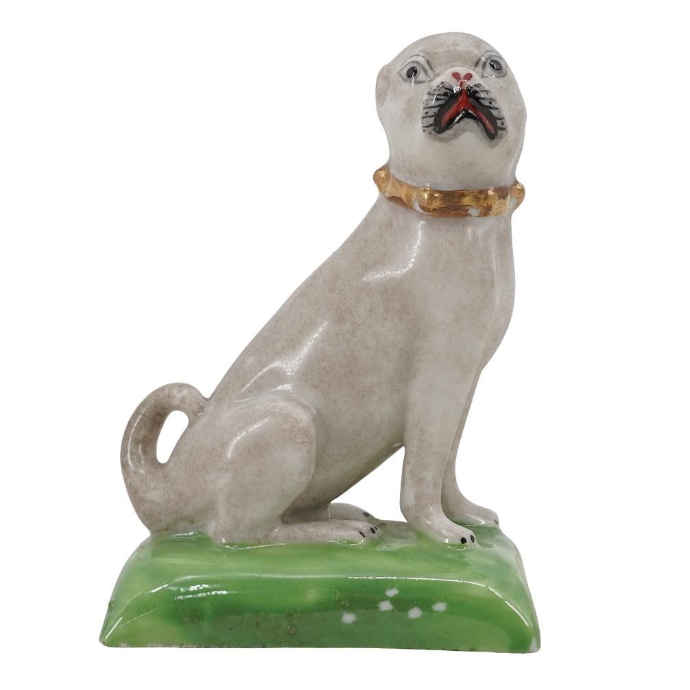 Antique Derby Porcelain Pug Figurine: Antique Derby Porcelain Pug FigurineEarly to Mid 20th c., EnglandAntique English porcelain dog figurine depicting a seated dog hand painted in white and grey with a gilded collar on a green grass base