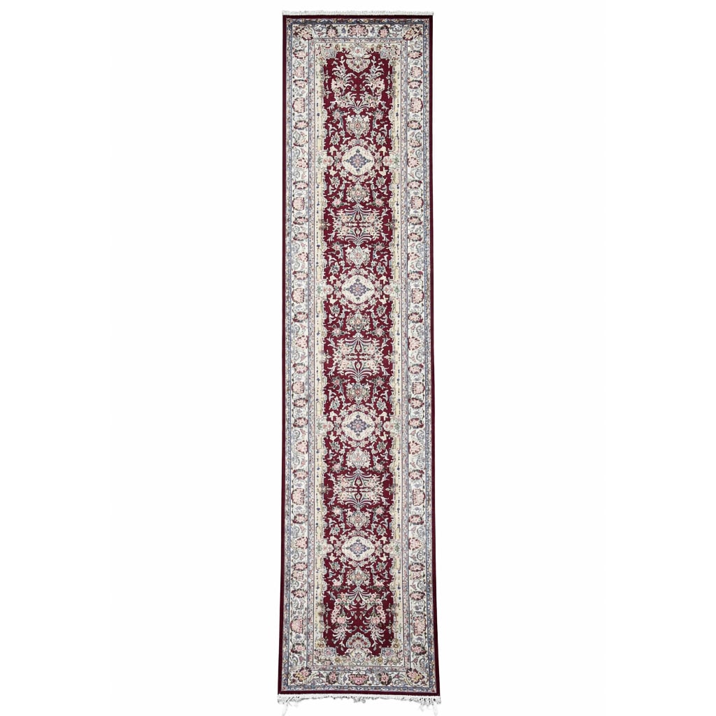 Persian Floral Wool Runner Rug: Persian Floral Wool Runner Rug 20th century A Persian runner rug featuring floral designs throughout. L 144" x W 30.25"