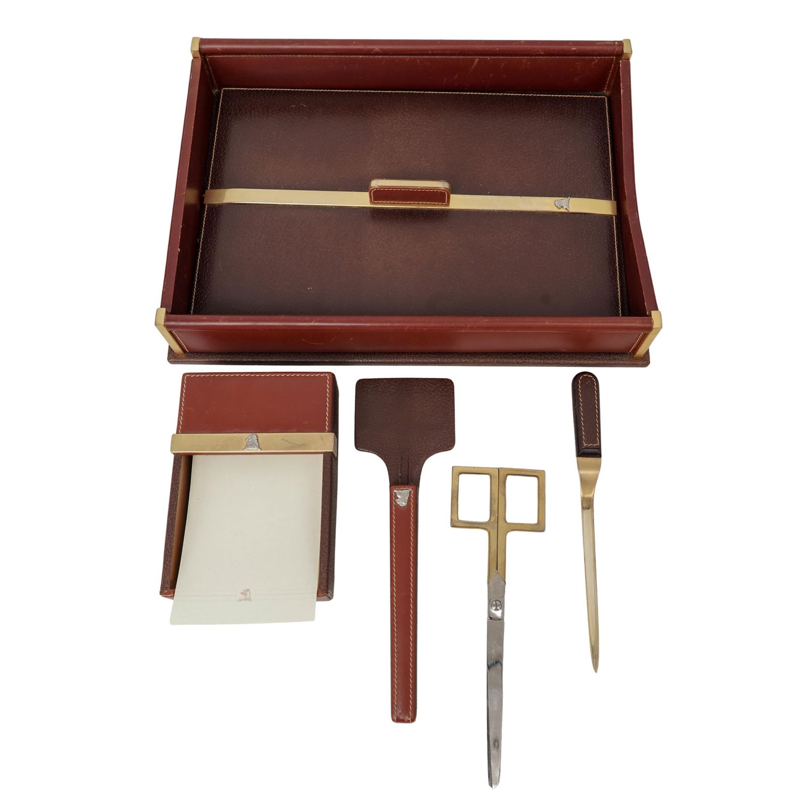 (6 pcs) Vintage Mark Cross Leather and Gold Plated Desk Set: (6 pcs) Vintage Mark Cross Leather and Gold Plated Desk Set circa 1970s, American A vintage Mark Cross leather and gold plated metal desk set. (2) Desk tray with privacy cover. Tray marked on bottom