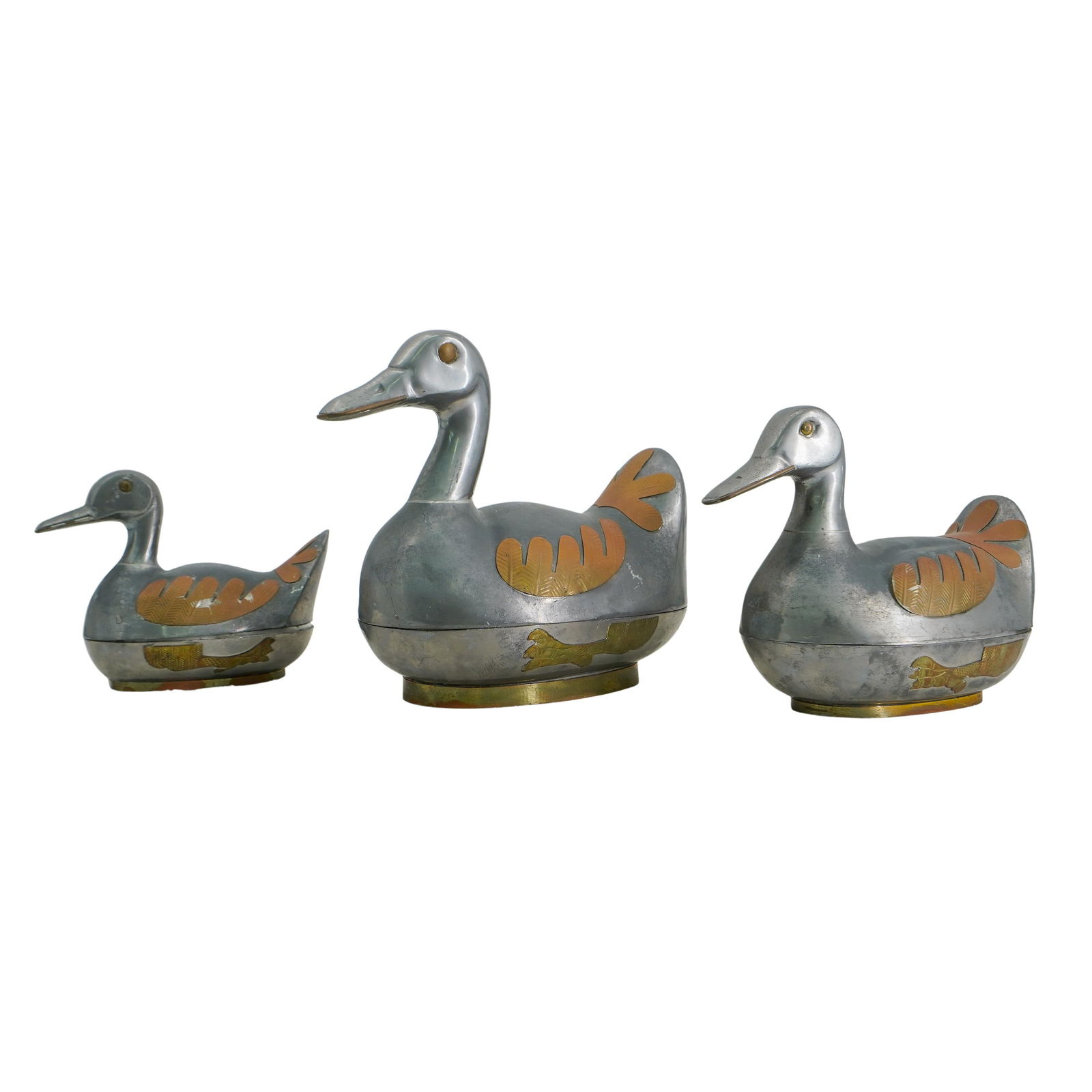 (3 pcs) Mid-Century Mixed Metal Duck Trinket Boxes: (3 pcs) Mid-Century Mixed Metal Duck Trinket Boxes 20th Century, China Pewter and brass trinket boxes in the shape of mallard ducks. Sit on brass bases. Three sizes. Marked "Made in the People's