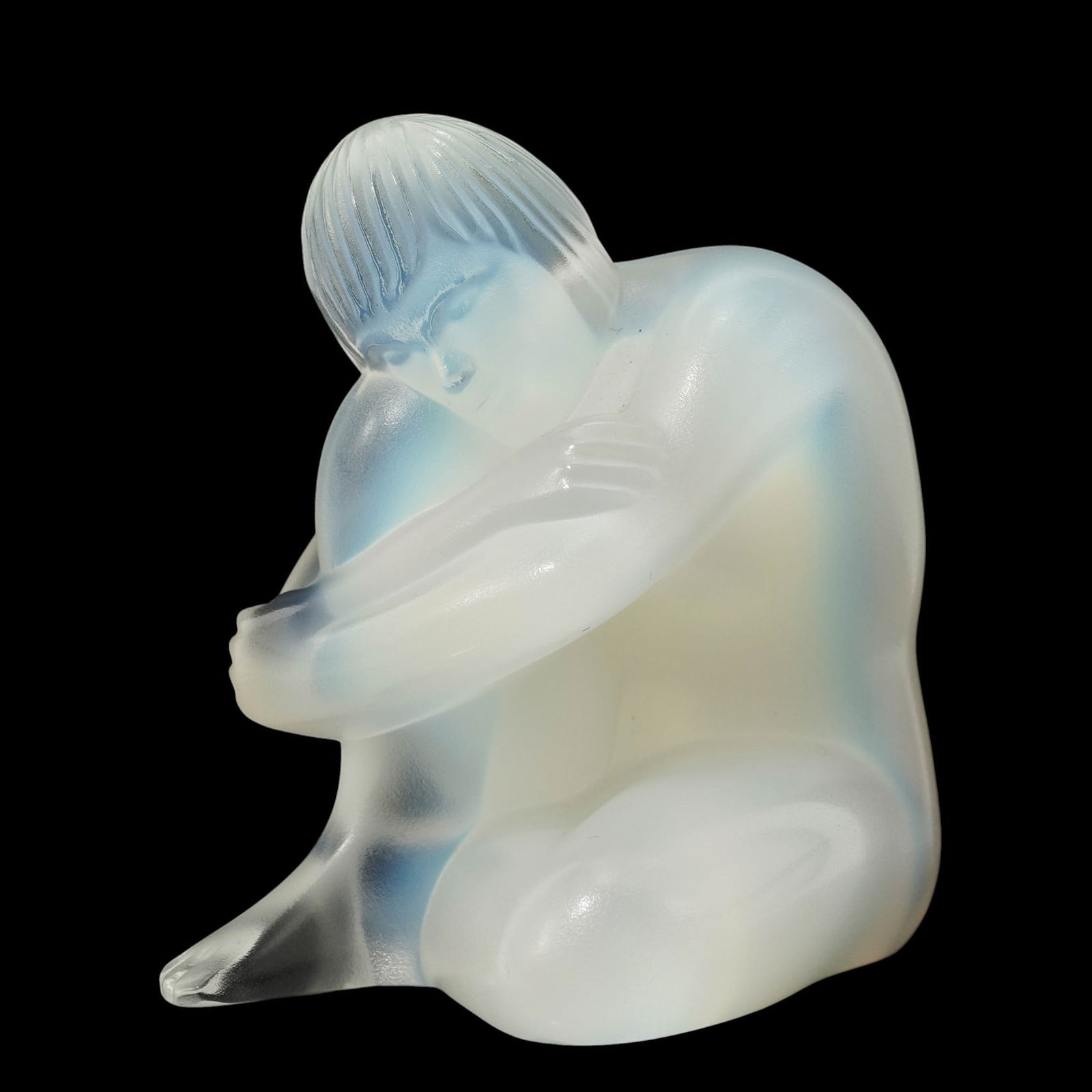 Lalique Opalescent Crystal Nude Sage Figurine: Lalique Opalescent Crystal Nude Sage Figurine 20th century, French The sculpture features a stylized, seated nude figurine with delicate detailing and a smooth, frosted finish. Etched with "Lalique