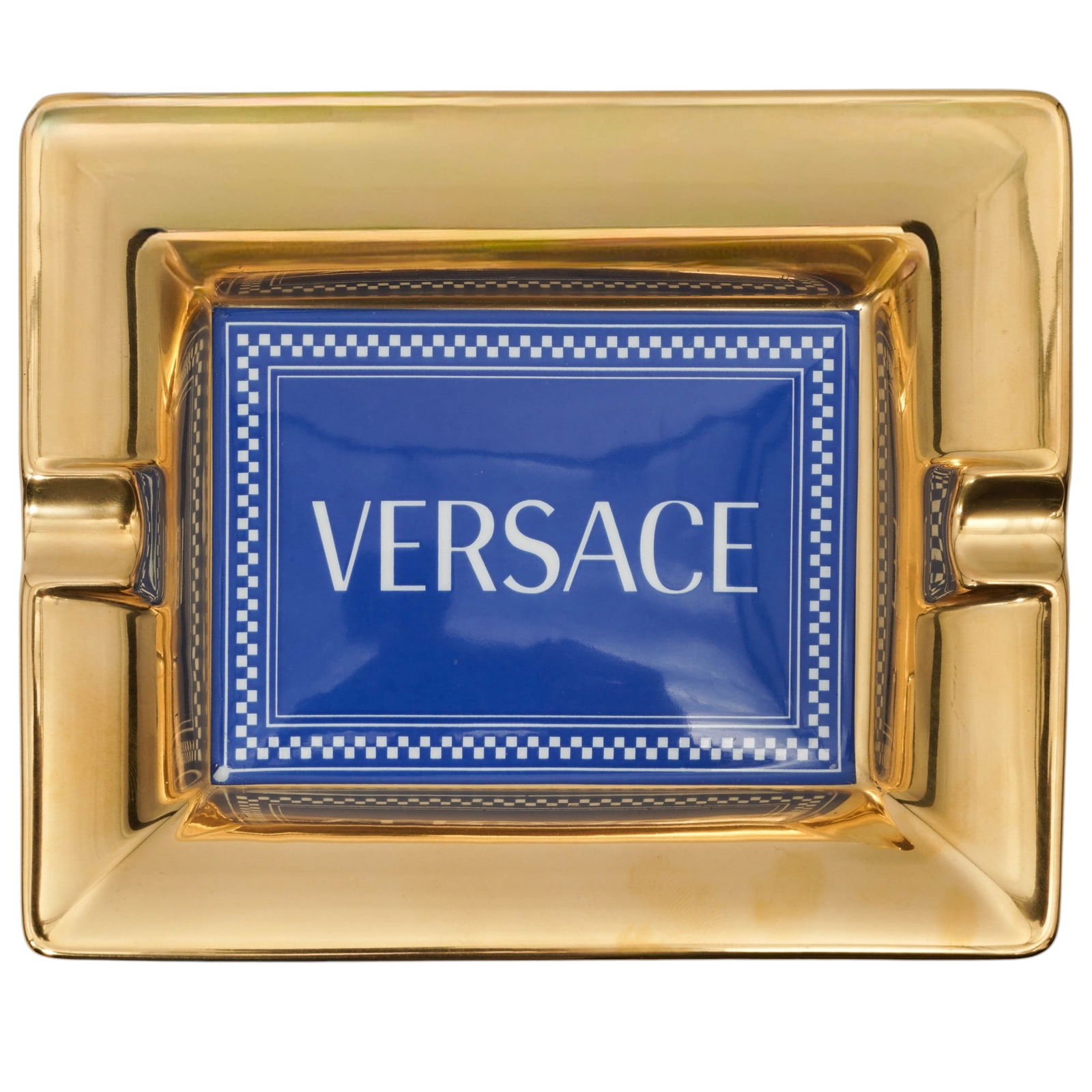 Versace x Rosenthal "Medusa Rhapsody" Porcelain Ashtray: Versace x Rosenthal "Medusa Rhapsody" Porcelain Ashtray20th century, GermanA Versace for Rosenthal Medusa Rhapsody porcelain ashtray featuring a gold-toned border and a blue rectangular center reading