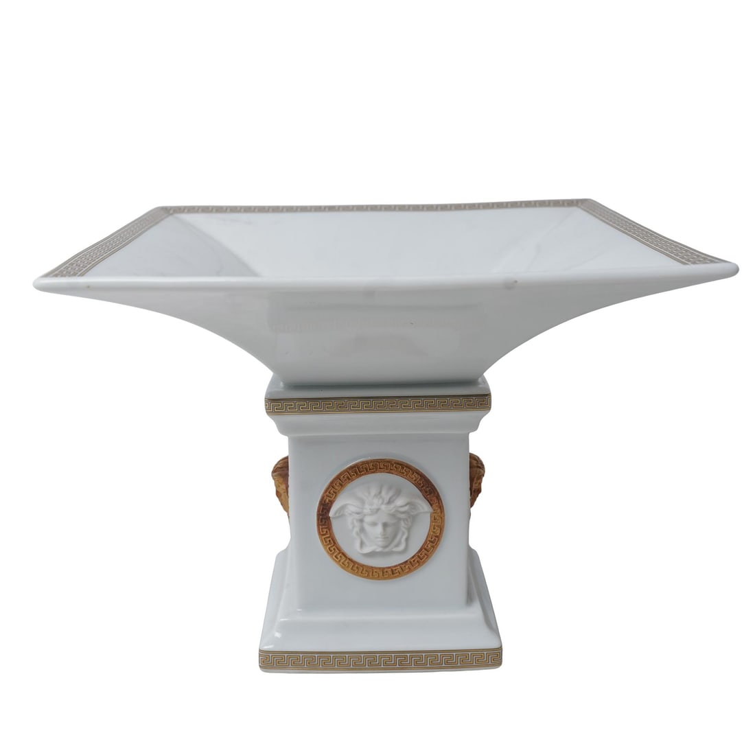 Versace x Rosenthal "Gorgona" Porcelain Pedestal Dish: Versace x Rosenthal "Gorgona" Porcelain Pedestal Dish1990. GermanThis piece is a collaboration between Rosenthal and Versace. "Gorgona" white porcelain pedestal dish featuring the Medusa medallion. Wh