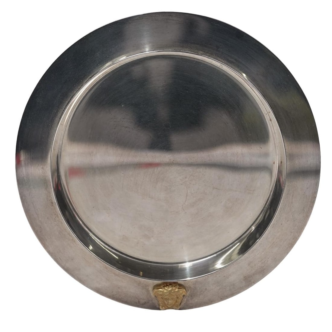 Versace x Rosenthal "Medusa" Stainless Steel Coaster: Versace x Rosenthal "Medusa" Stainless Steel Coaster20th century, GermanThis Medusa stainless steel coaster is part of the Versace bar essentials and home decor line. This piece is characterized by it