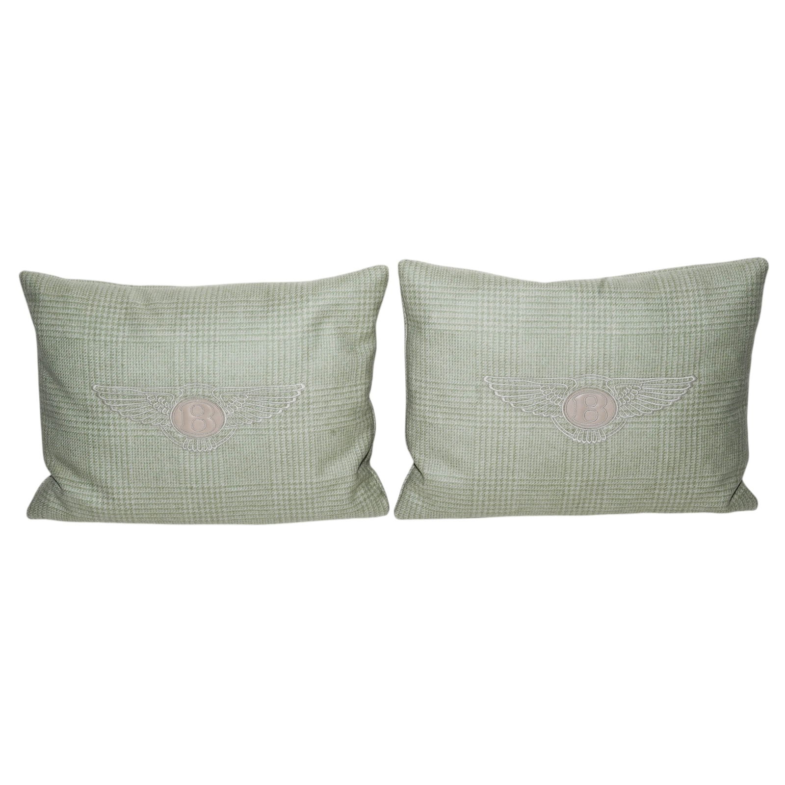 Pair Bentley Green Tweed Pillows: Pair Bentley Green Tweed Pillows 21st century, Italian A pair of Bentley green tweed pillows with white leather "B" logo and embroidered wings. Pillows have silver tone metal "Bentley" plaque in