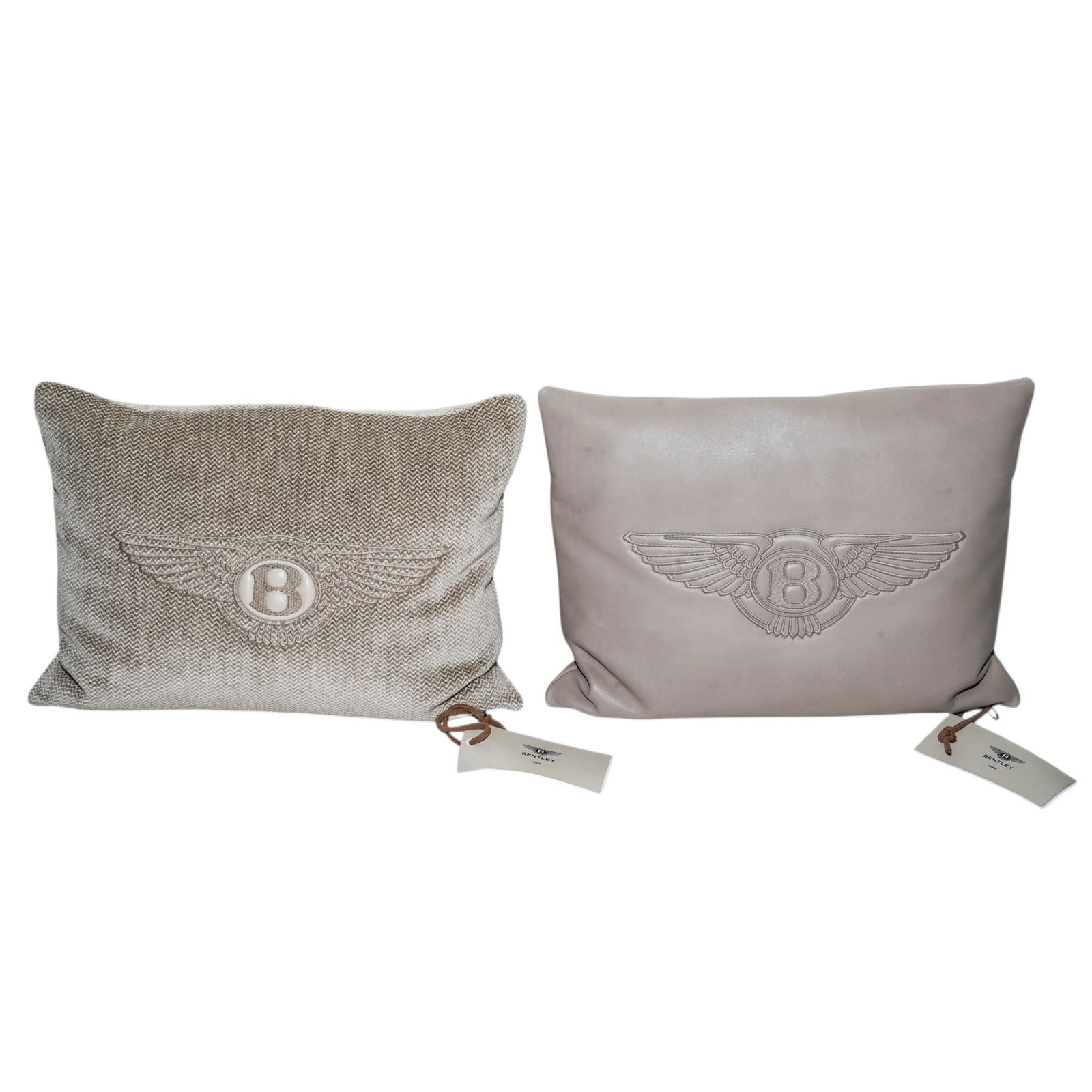 (2 Pc) Bentley "Sand" Leather & Herringbone Pillows: (2 Pc) Bentley "Sand" Leather & Herringbone Pillows21st century, ItalianA set of Bentley "sand" herringbone patterned and leather pillows with leather "B" logo and embroidered wings. Pillows have silv