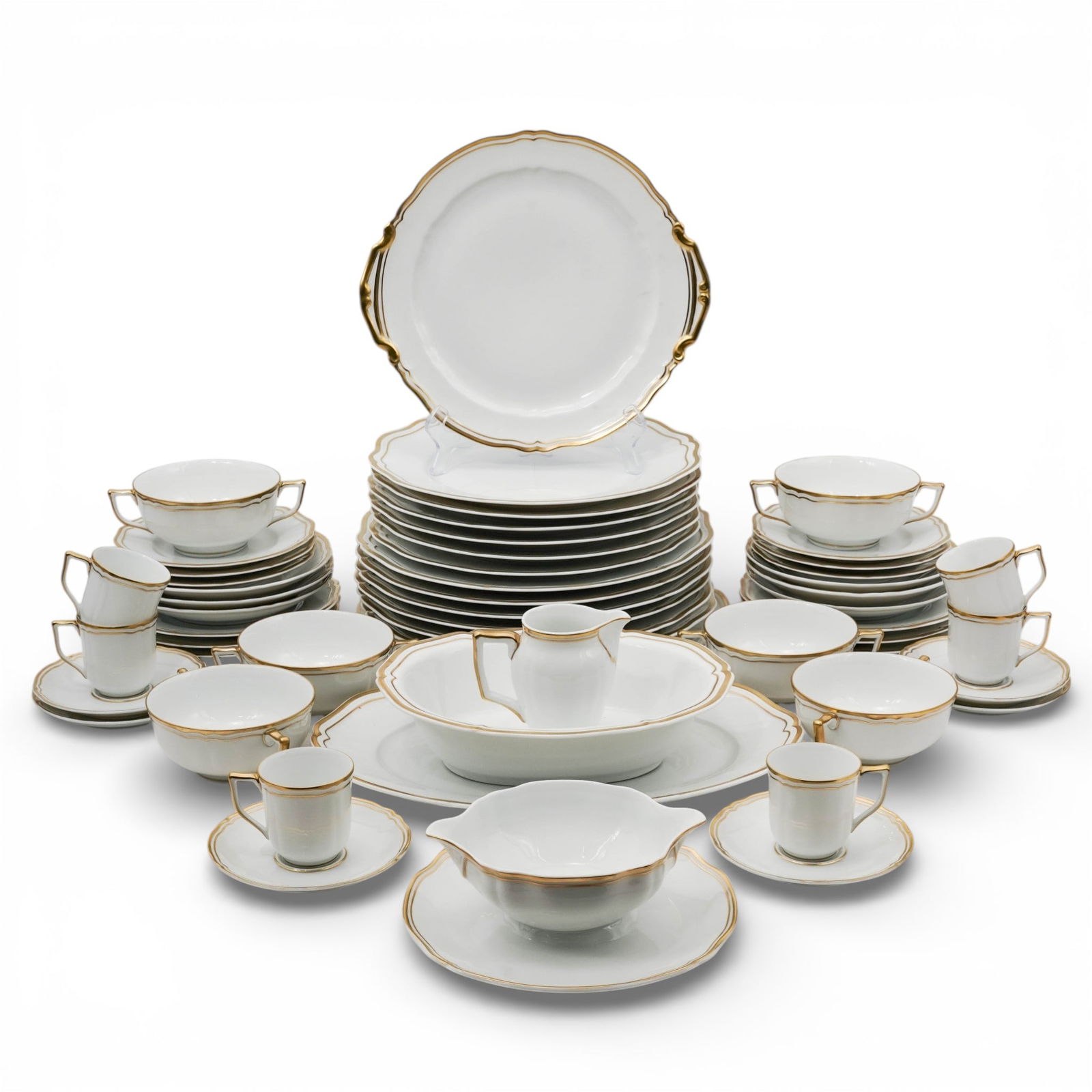 (54 Pc) Raynaud Limoges Gilt Porcelain Service: (54 Pc) Raynaud Limoges Gilt Porcelain ServiceEarly to mid 20th century, FrenchA Raynaud Limoges gilt porcelain service set with petal cut rims. Each marked on bottom "Raynaud Limoges made in France d