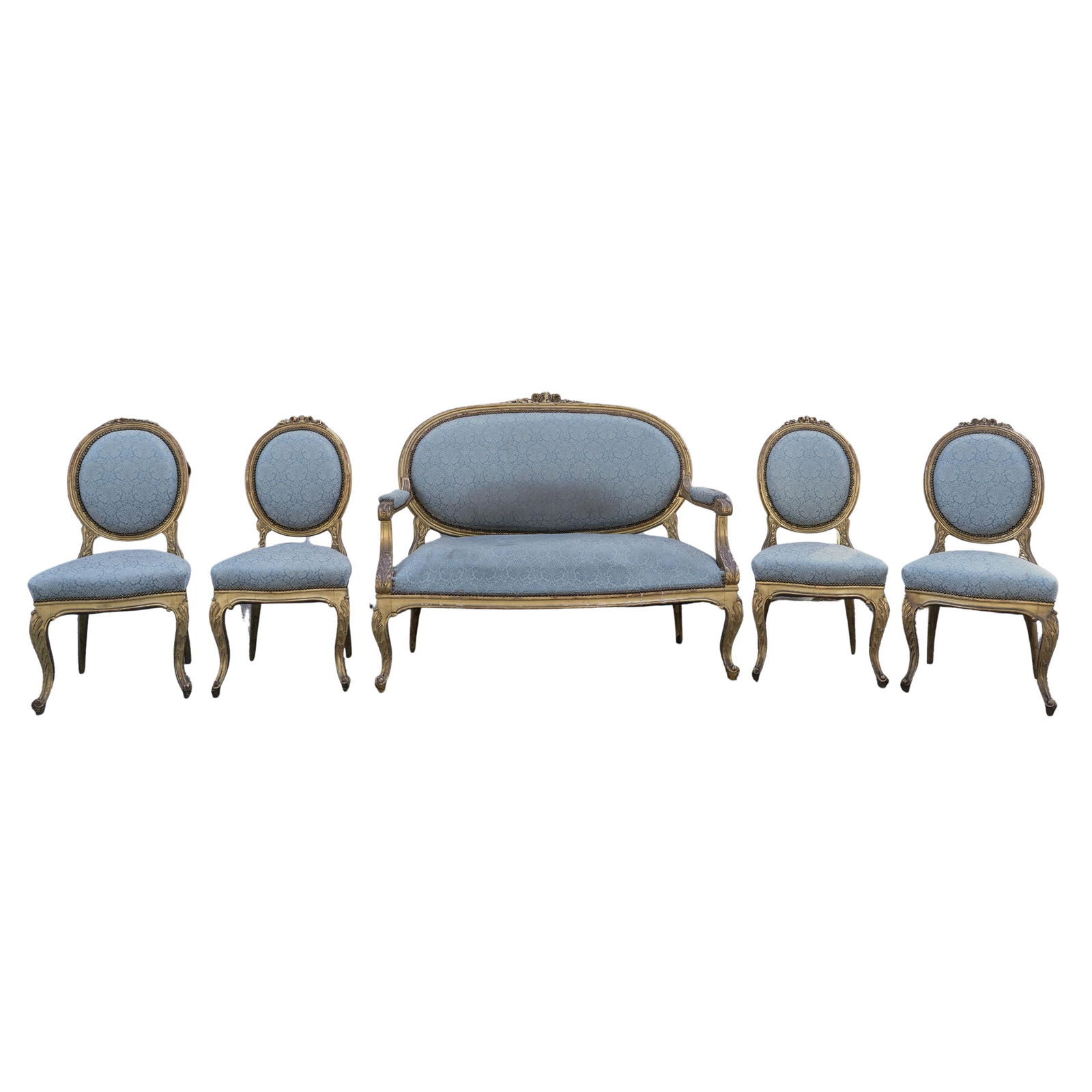 (5 pcs) French Louis XVI Style Salon Set: (5 pcs) French Louis XVI Style Salon SetLate 19th-early 20th century, FrenchA set of four chairs and one loveseat in a Louis XVI style featuring gilt floral carved wood frames and blue damask upholste