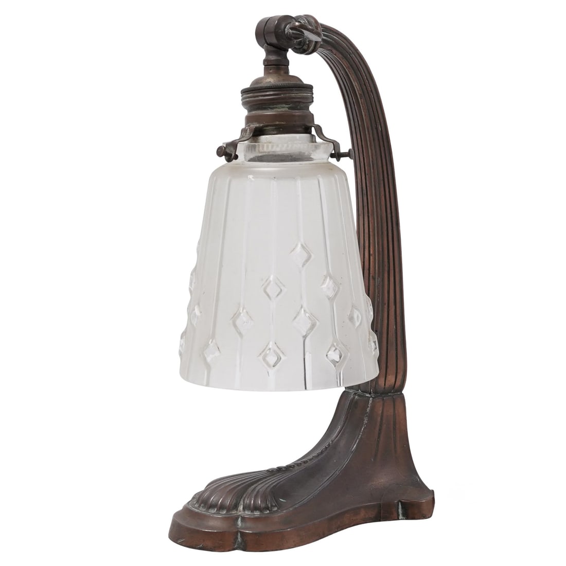 Antique Spelter Task Lamp: Antique Spelter Task Lamp c. 1920s, Europe Antique Art Nouveau desk lamp featuring a curved arm and scalloped metal base. It has a frosted glass shade with vertical stripes and a diamond-dotted