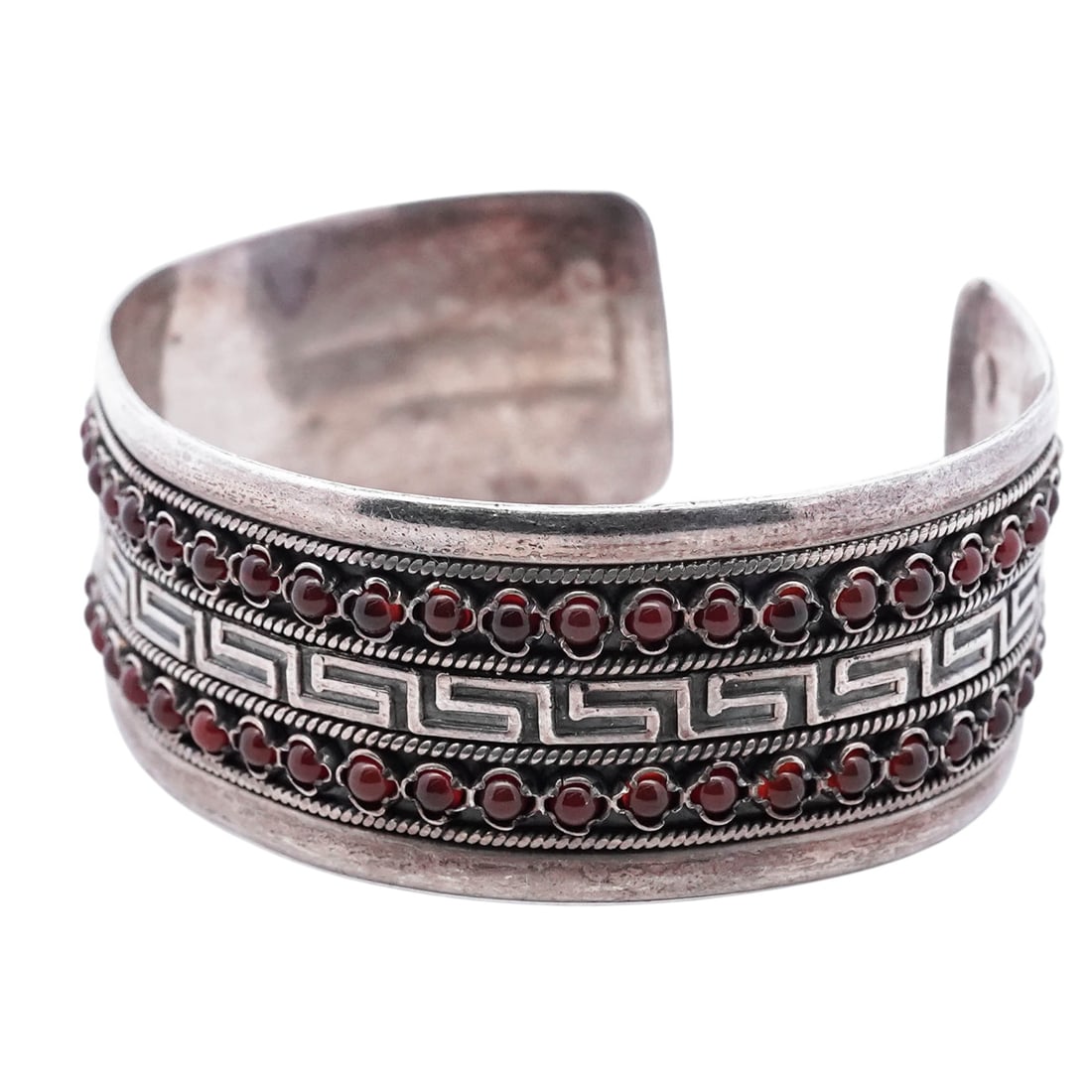 Krissos Vintage Greek Sterling Silver & Coral Bracelet: Krissos Vintage Greek Sterling Silver & Coral Bracelet Late 20th century, Greece Vintage Sterling silver cuff bracelet by Krissos, Greece, featuring two continuous rows of round red coral cabochons,