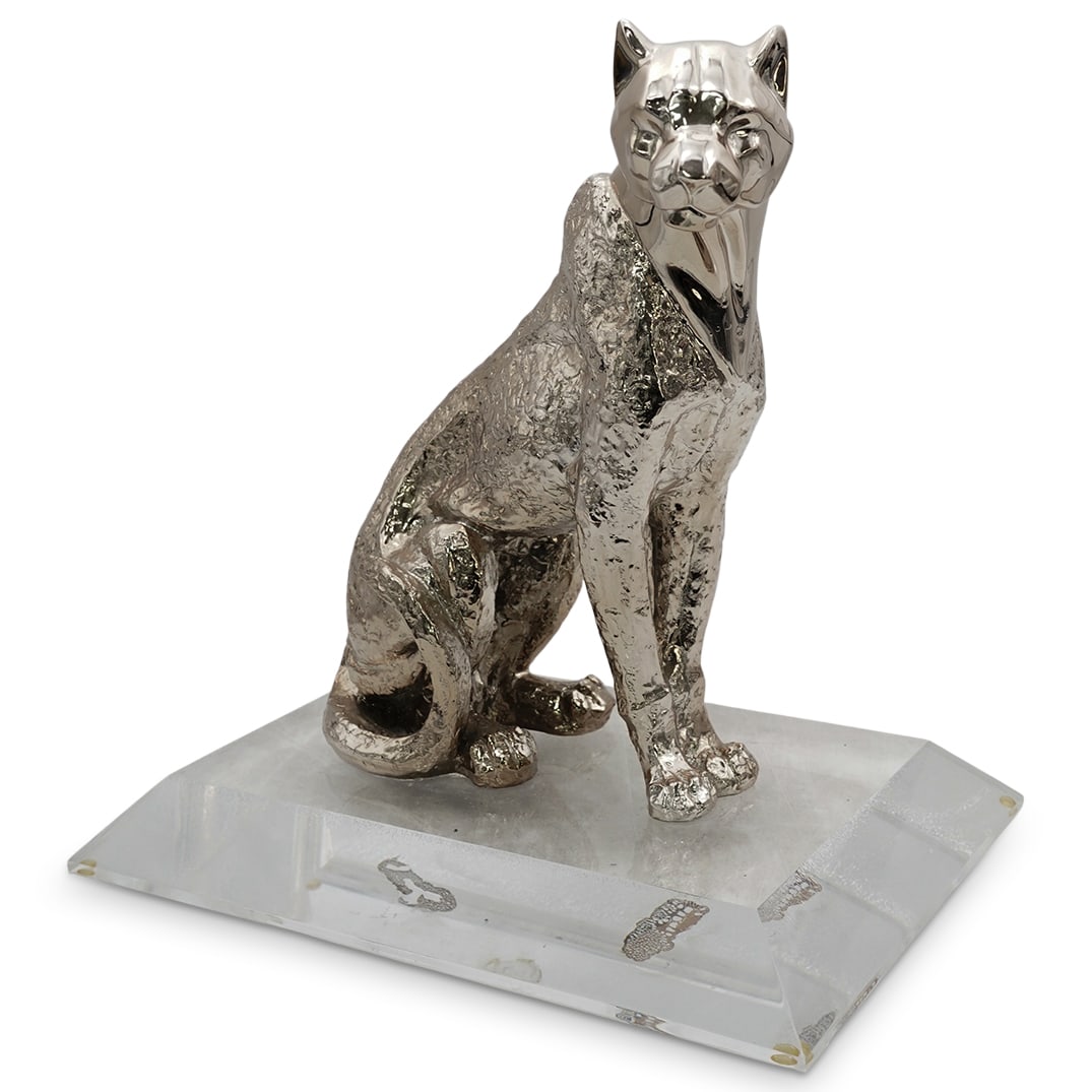 Silver Overlay Jaguar Statue: Silver Overlay Jaguar StatueMid to late 20th centuryA jaguar or panther statue in a seated position with a silver-toned overlay and affixed to a lucite base.H 18.25" x Base L 17.5" x Base W 12.5"