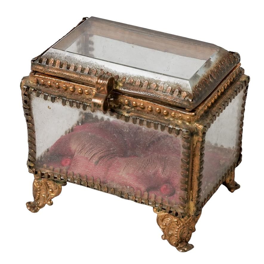 Antique French Gilt Beveled Glass Casket Box: Antique French Gilt Beveled Glass Casket BoxLate 19th-Early 20th c., FranceAntique jewelry box featuring five panels of thick, beveled glass set into a gilded brass frame with a red tufted silk cushio
