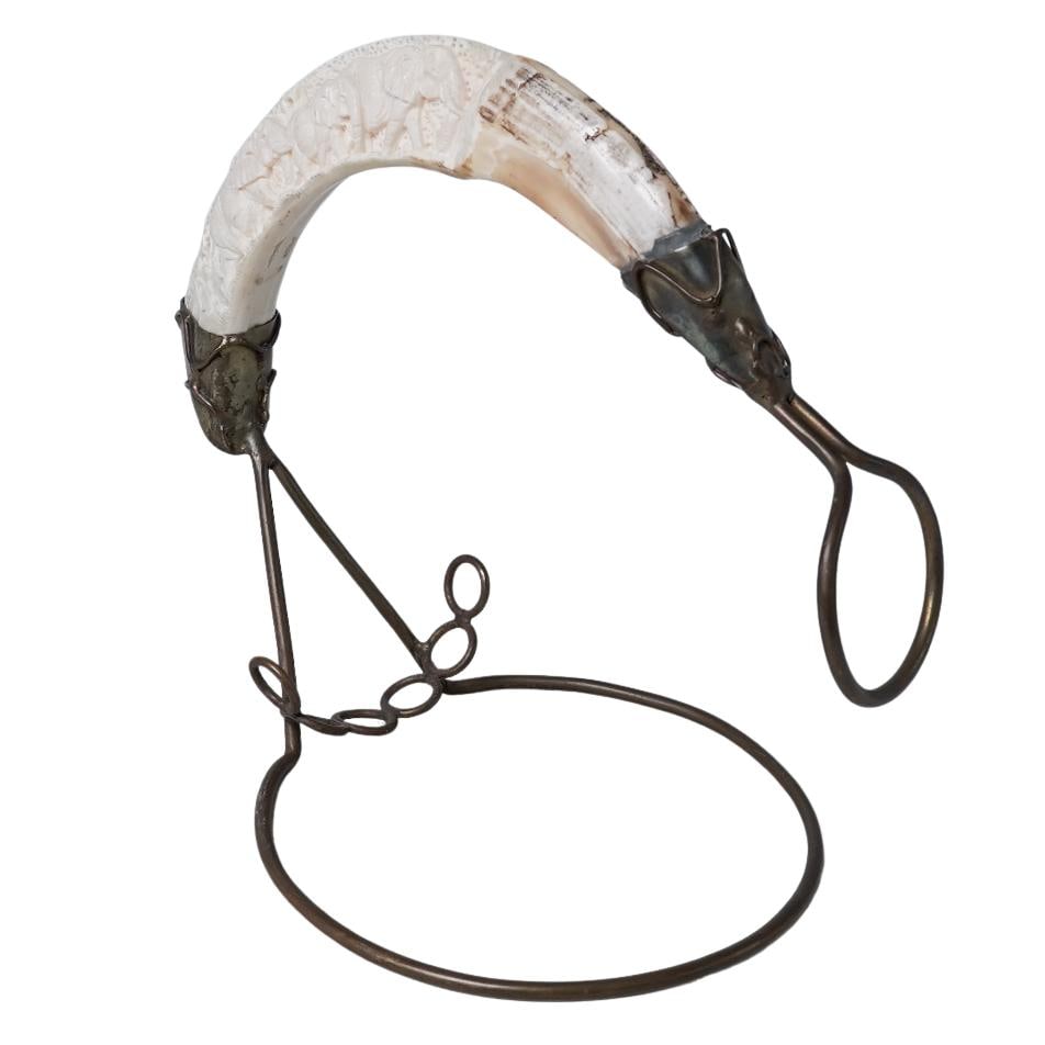 Rare Antique Hand Carved Horn Bottle Cradle: Rare Antique Hand Carved Horn Bottle Cradle Late 19th-early 20th century, Rare antique hand carved elephant motif warthog tusk wine bottle cradle H 8" x Base diameter 6.25" x Horn L approx. 10"