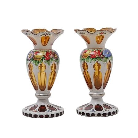 Pair of Bohemian Amber Glass Hand-Painted Floral Vases: Pair of Bohemian Amber Glass Hand-Painted Floral VasesEarly to mid 20th century, CzechA pair of Bohemian amber glass with white enameled overlay and hand-painted floral motifs, with gilt accenting.H 6