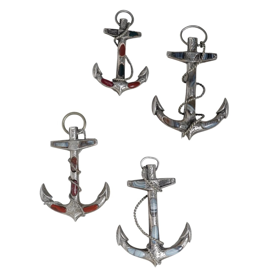 (4 Pc) Victorian Silver & Stone Inlaid "Fouled Anchor" Brooches: (4 Pc) Victorian Silver & Stone Inlaid "Fouled Anchor" BroochesLate 19th-Early 20th c., United KingdomAntique engraved sterling silver fouled anchor brooches featuring a ship's anchor entwined with ro