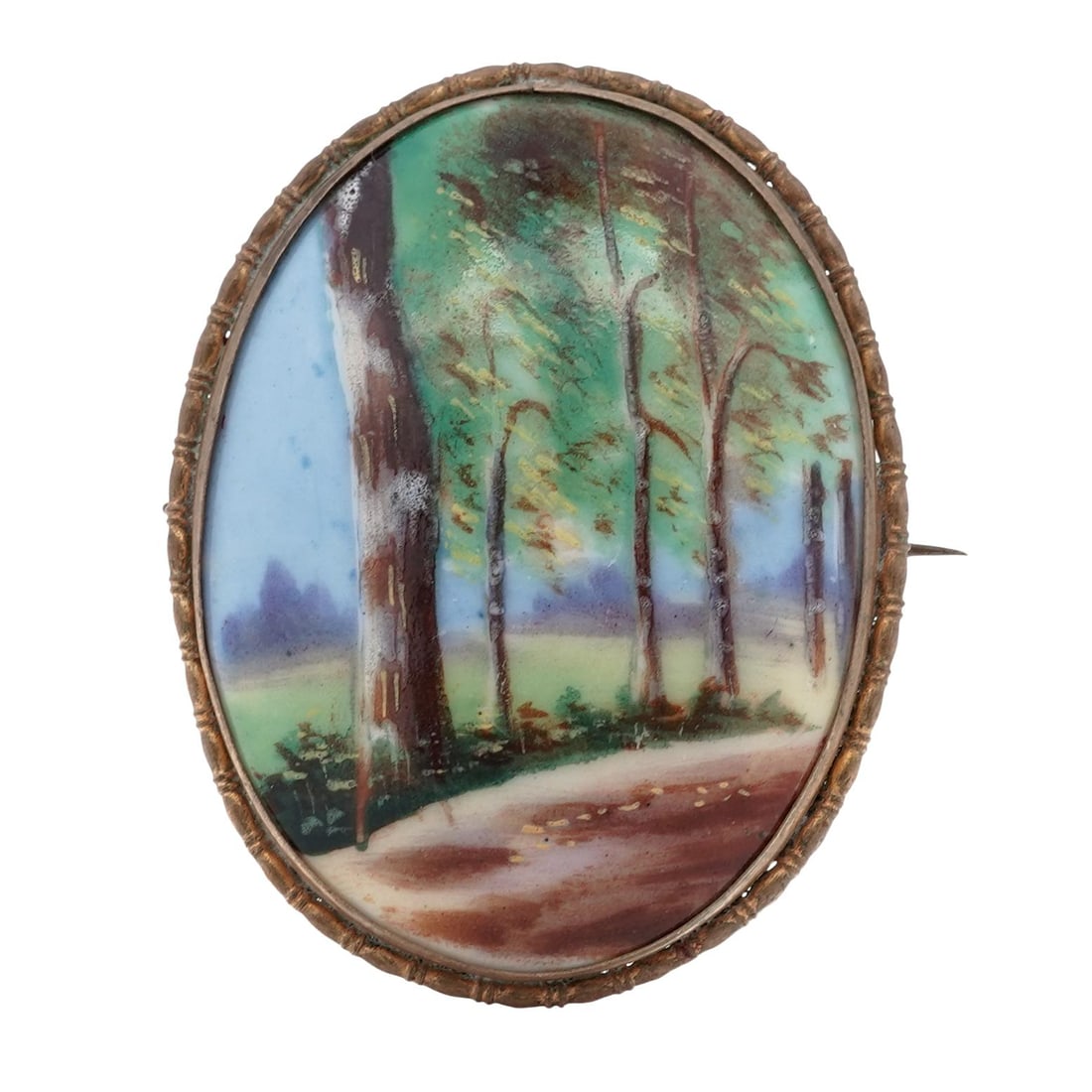 Vintage Gold Enameled Porcelain Landscape Brooch: Vintage Gold Enameled Porcelain Landscape BroochEarly–Mid 20th CenturyVintage gold oval porcelain brooch hand-painted with a pastoral landscape scene depicting trees along a winding path, executed i
