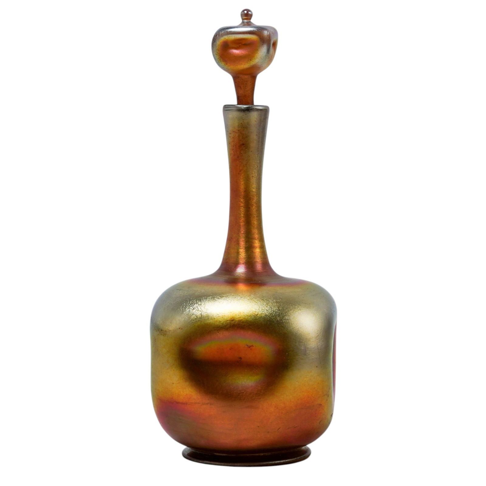 Louis Comfort Tiffany Gold Favrile Glass Decanter: Louis Comfort Tiffany Gold Favrile Glass DecanterEarly 20th century, AmericanLouis Comfort Tiffany gold favrile glass decanter. Marked on bottom "L.C.T. 6708" and marked on bottom of stopper "70".H 9.