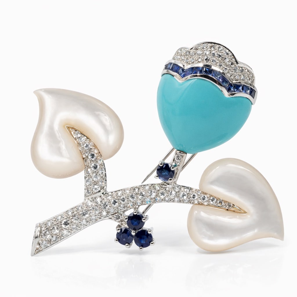 Vintage 18k Gold Turquoise MOP Diamond & Sapphire Brooch Signed: Vintage 18k Gold Turquoise MOP Diamond & Sapphire Brooch SignedLate 20th CenturyVintage brooch made in 18k white gold, featuring a polished turquoise cabochon flanked by carved mother-of-pearl element