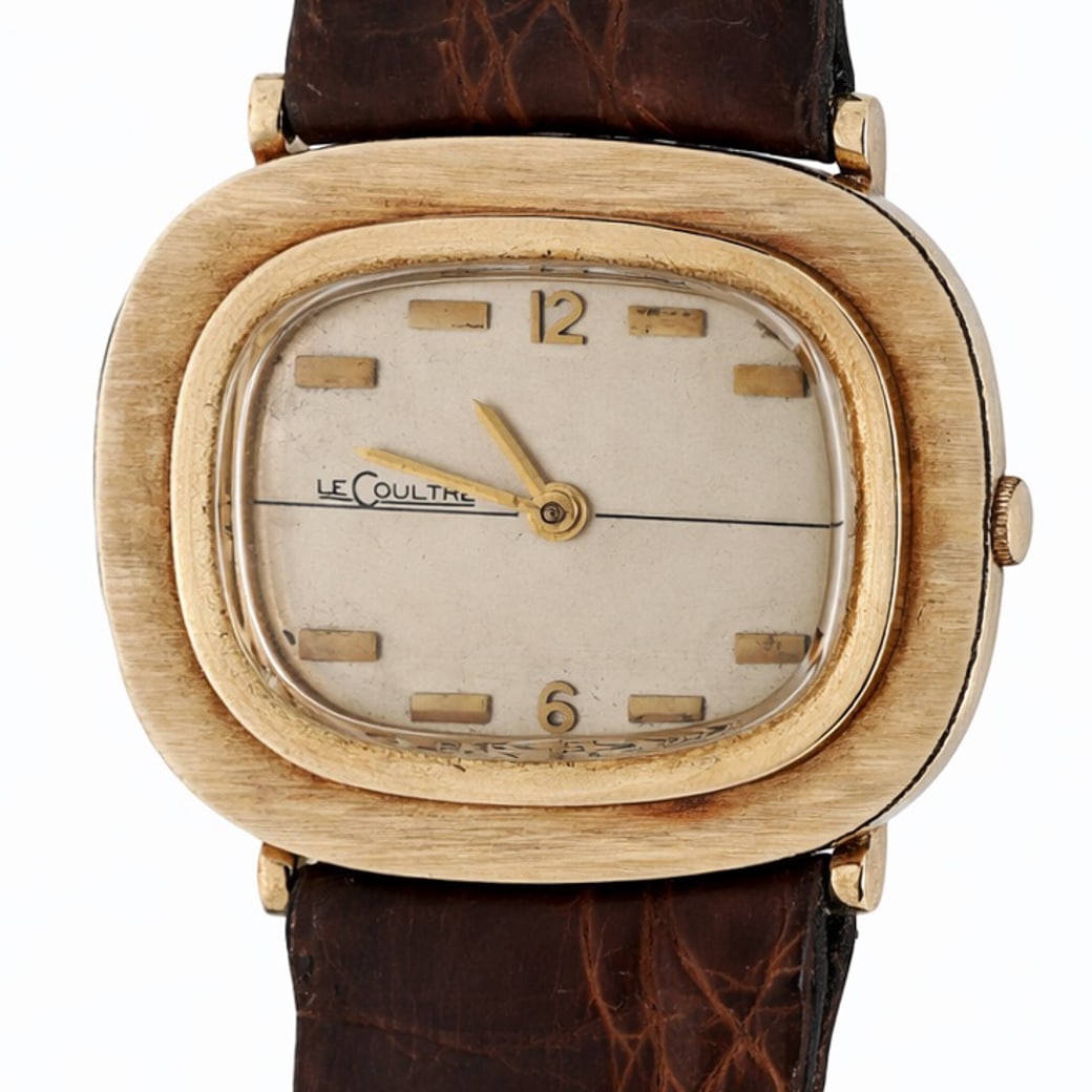 Vintage LeCoultre 14k Gold Cushion Case Watch: Vintage LeCoultre 14k Gold Cushion Case Watch1960s–1970s, SwissVintage LeCoultre wristwatch produced for the American market, housed in a solid 14K yellow gold cushion-shaped case with horizontally