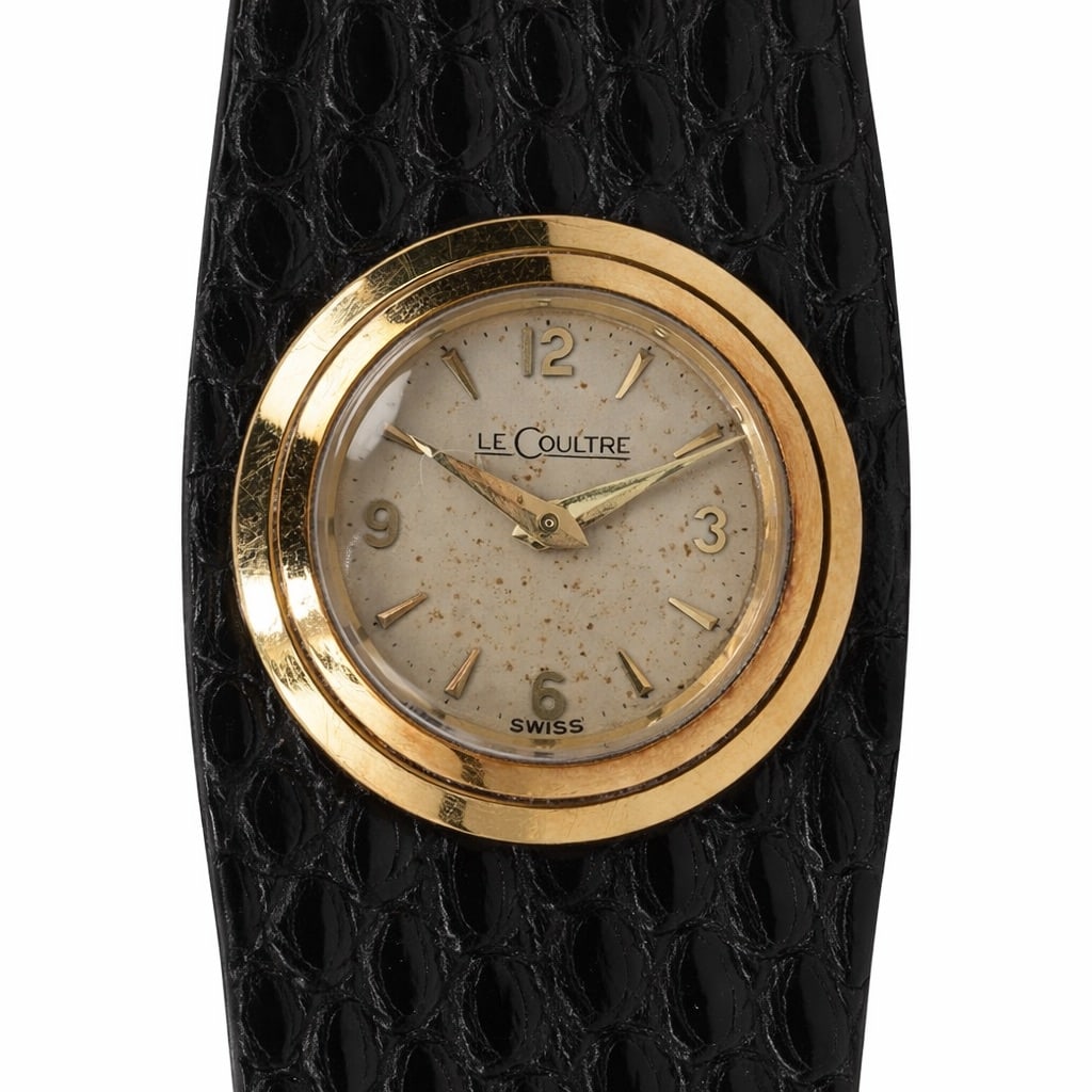 Vintage LeCoultre 18K Gold Interchangeable Strap Ladies Watch: Vintage LeCoultre 18K Gold Interchangeable Strap Ladies WatchMid-20th century, SwissSwiss ladies watch by LeCoultre featuring an interchangeable strap system with multiple leather bands. Cream dial si