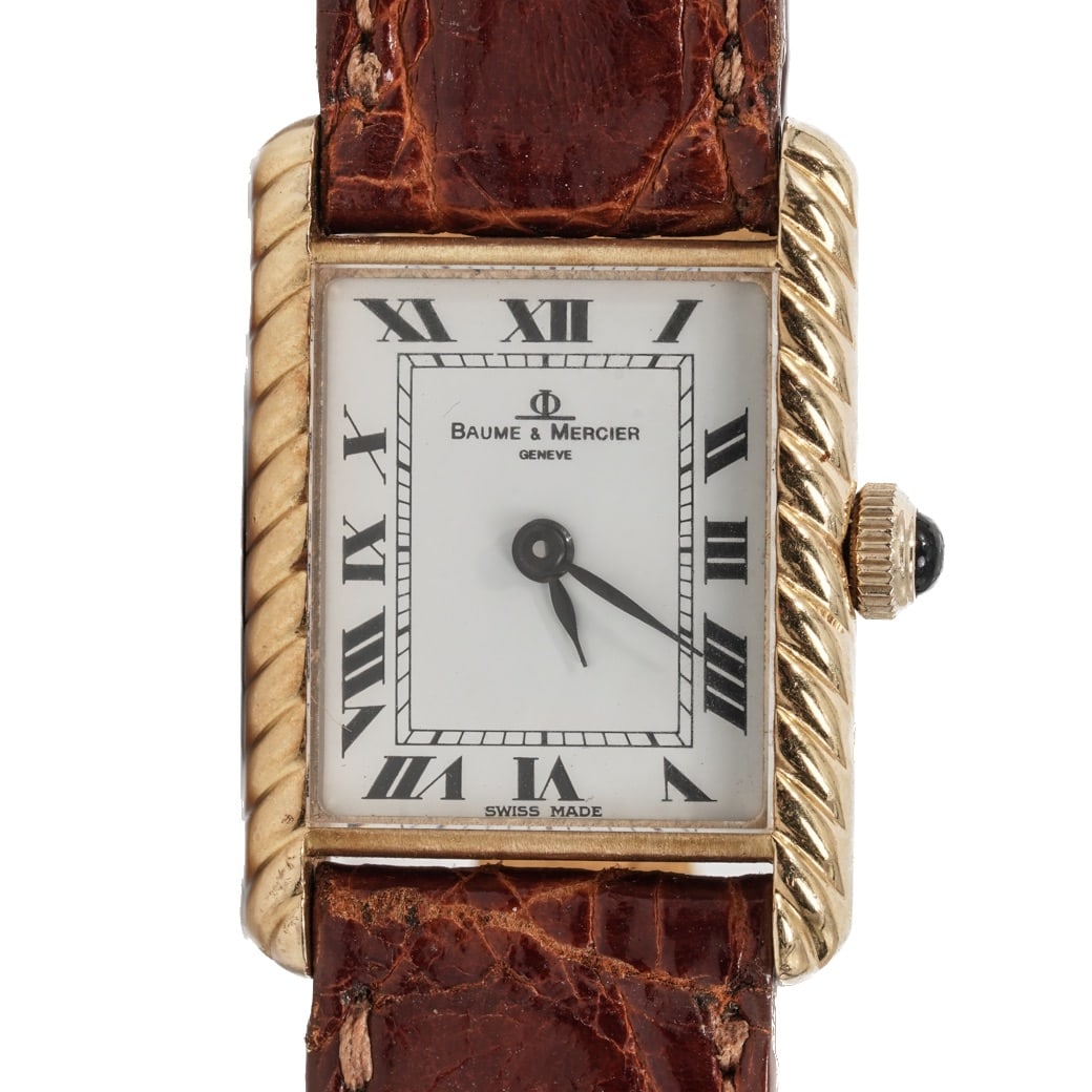 Baume & Mercier "Tank" 18K Gold Ladies Watch REF# 38307: Baume & Mercier "Tank" 18K Gold Ladies Watch REF# 383071980s-1990s, SwitzerlandBaume & Mercier rectangular tank wristwatch, reference 38307 BZ. White dial with black Roman numeral hour markers, chemin