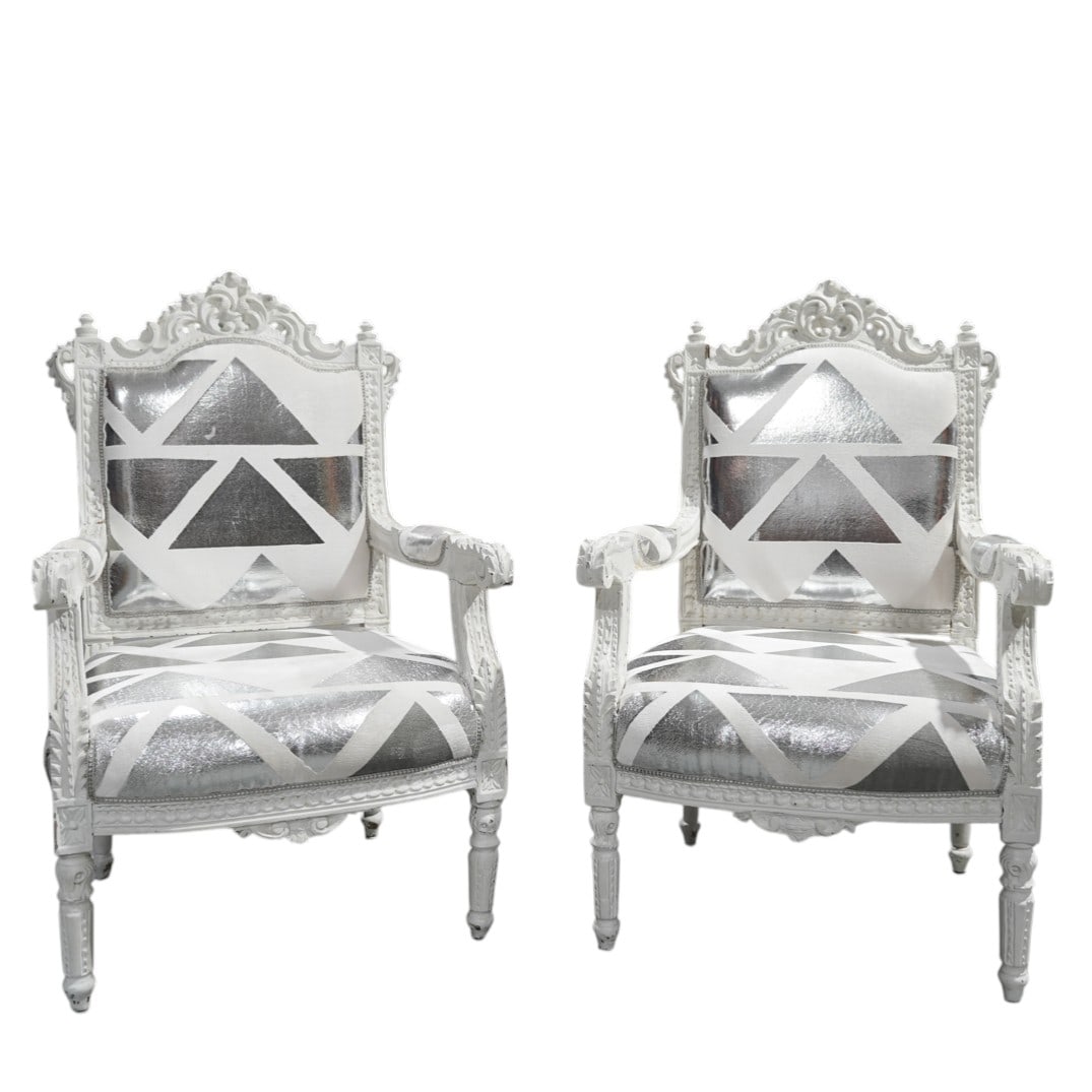 Pair of Antique French Fauteuils with Designer's Guild Upholstery: Pair of Antique French Fauteuils with Designer's Guild Upholstery20th Cent., FrenchA pair of antique French fauteuils (armchairs), characterized by white decoratively carved wood frame with open arms.