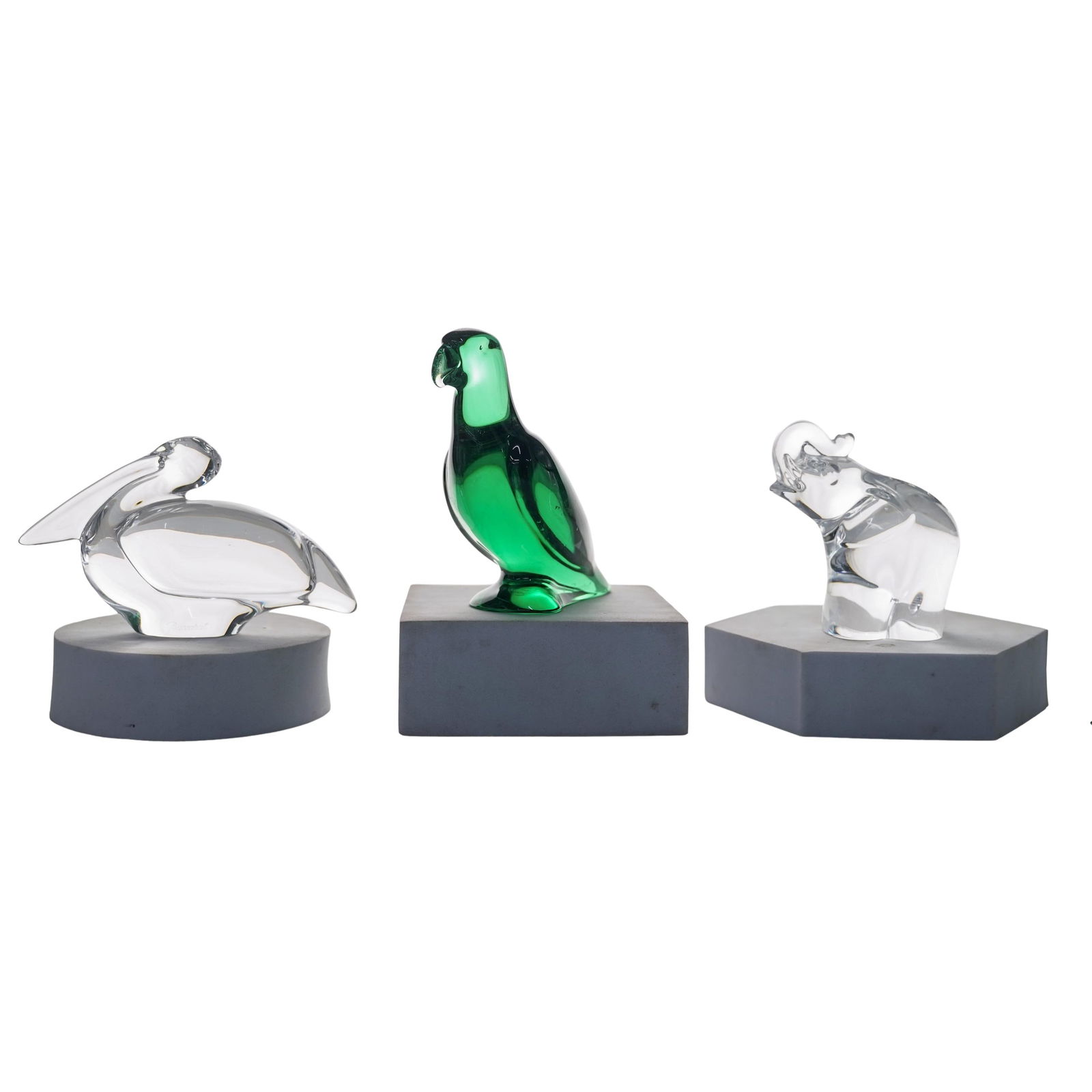 (3 Pc) Baccarat Crystal Figurines: (3 Pc) Baccarat Crystal Figurines20th century, French, USALot includes:(1) Baccarat clear crystal pelican designed by renowned artist Michele Oka Doner(1) Baccarat crystal emerald parrot(1) Steuben lu