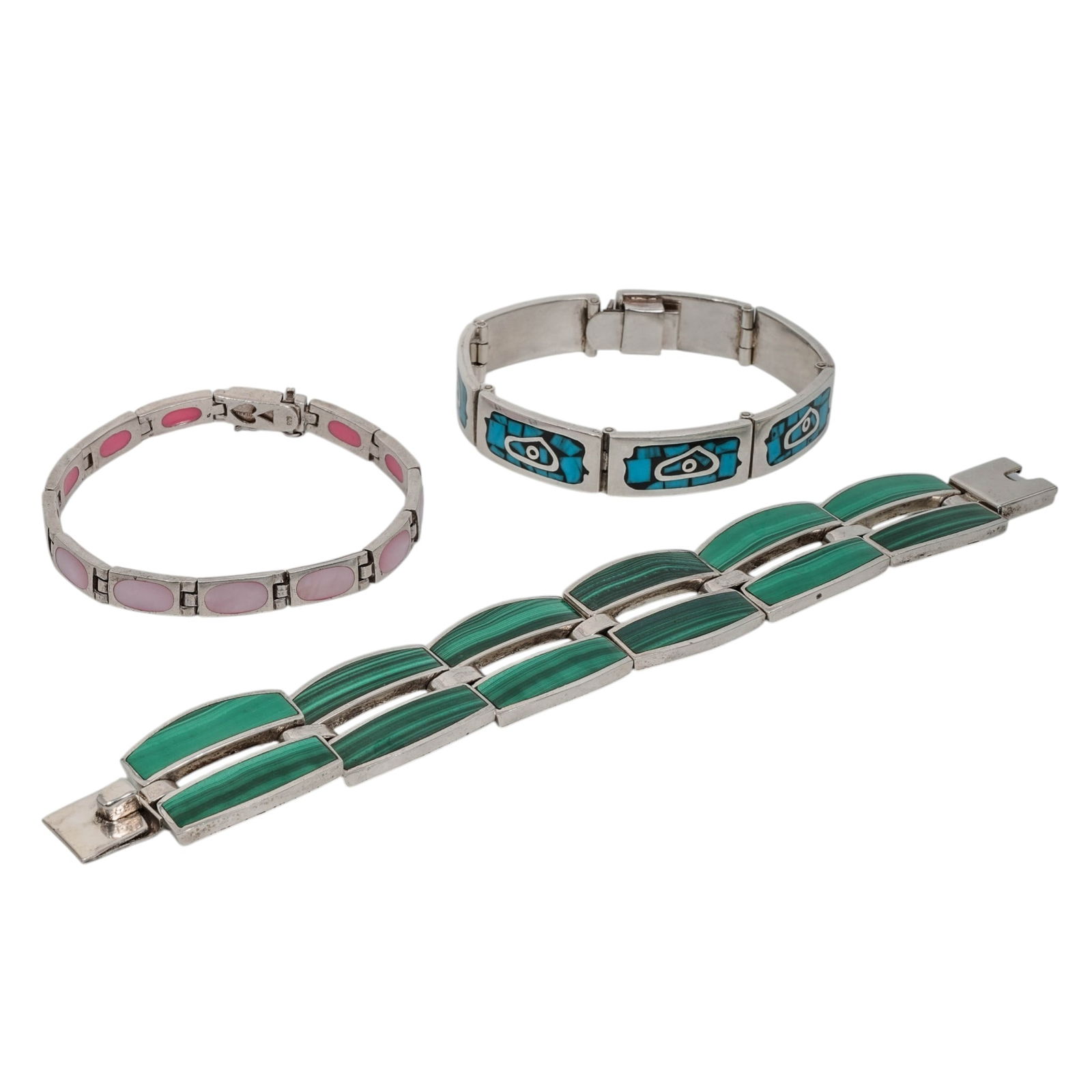 (3 Pcs) Sterling Silver & Hardstone Link Bracelets: (3 Pcs) Sterling Silver & Hardstone Link BraceletsLate 20th Century, Mexico/ ThailandGroup of three articulated sterling silver link bracelets comprising a malachite panel bracelet; a turquoise mosaic