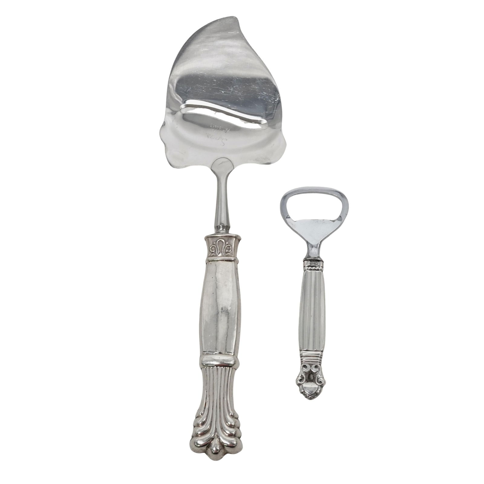(2 pc) Georg Jensen "Acorn" Sterling Bottle Opener & Cheese Plane: (2 pc) Georg Jensen "Acorn" Sterling Bottle Opener & Cheese Plane 20th century, Danish, Norwegian Two Georg Jensen "Acorn" sterling silver items. (1) Georg Jensen, Acorn Pattern, Sterling Silver