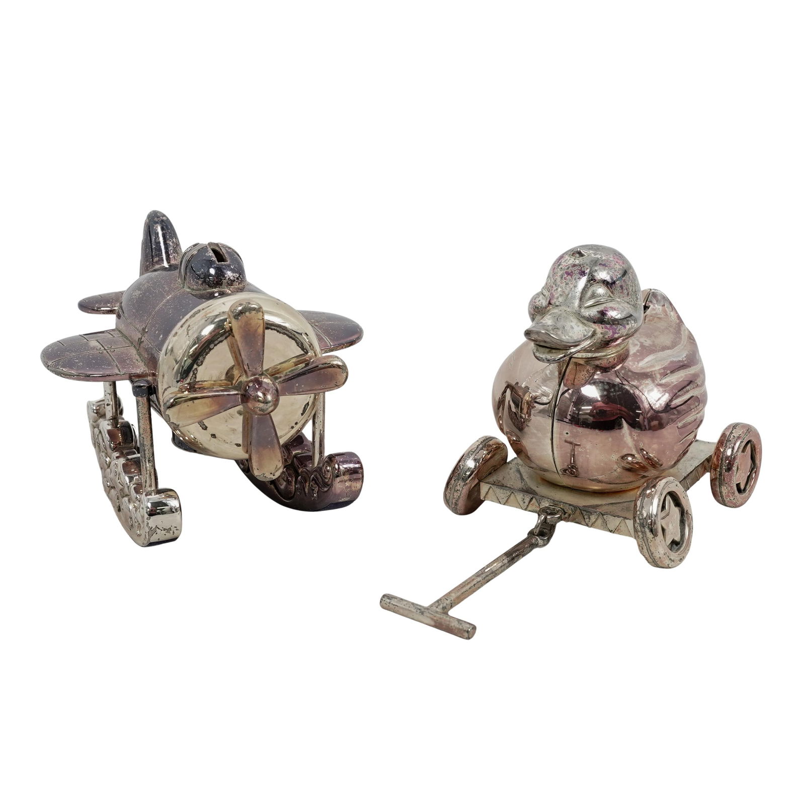 (2 Pc) Reed & Barton Silver Plated Coin Banks: (2 Pc) Reed & Barton Silver Plated Coin Banks 20th century, USA The two banks are part of the "Zoom Zoom" and "Just Ducky" series of children's coin banks produced by Reed & Barton. The seaplane bank