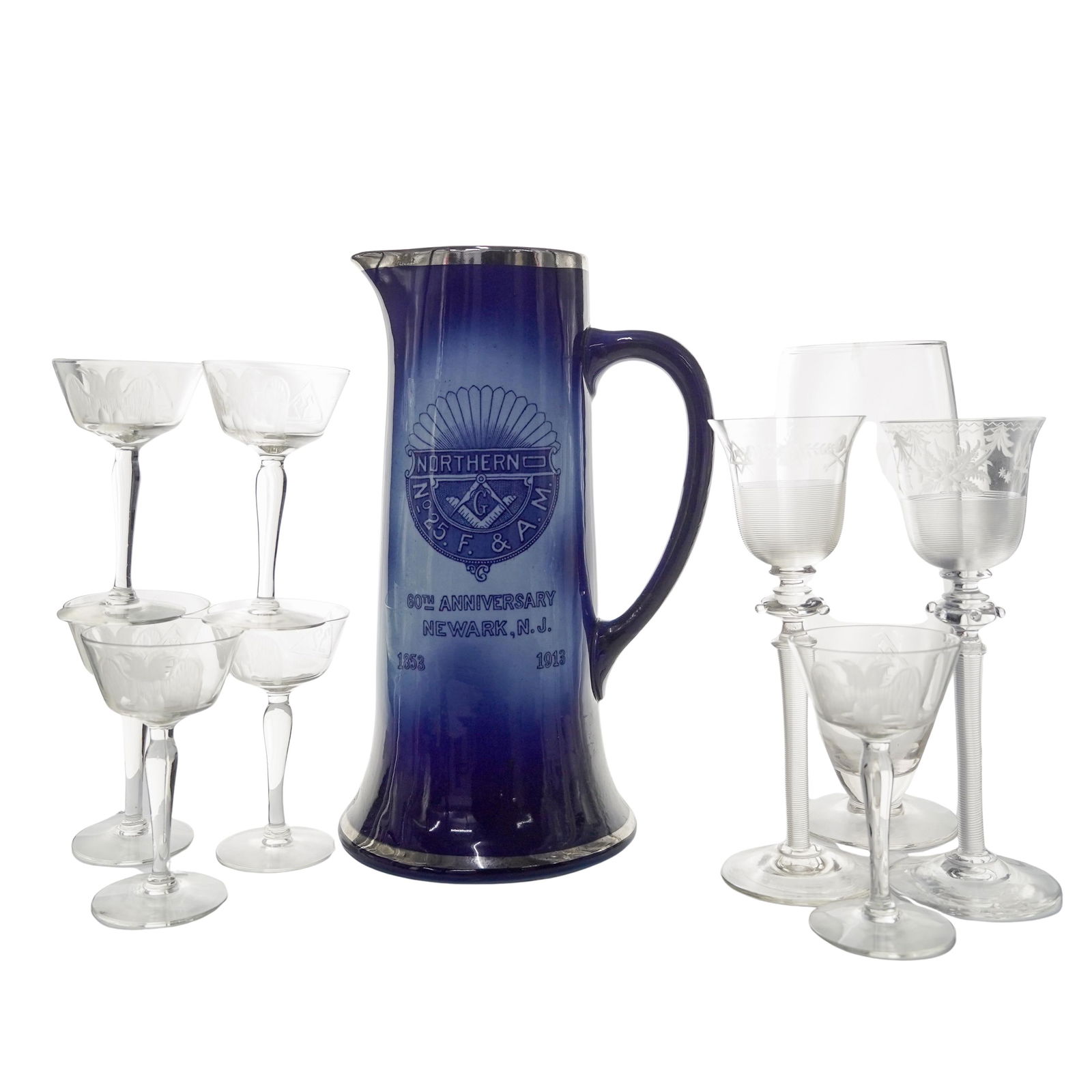 (10 Pc) Antique Masonic Porcelain Pitcher & Etched Glasses: (10 Pc) Antique Masonic Porcelain Pitcher & Etched GlassesEarly 20th century, AmericanTen piece set of antique Masonic porcelain pitcher and etched glass stemware. Includes:(6 Pc) six wine etched glas