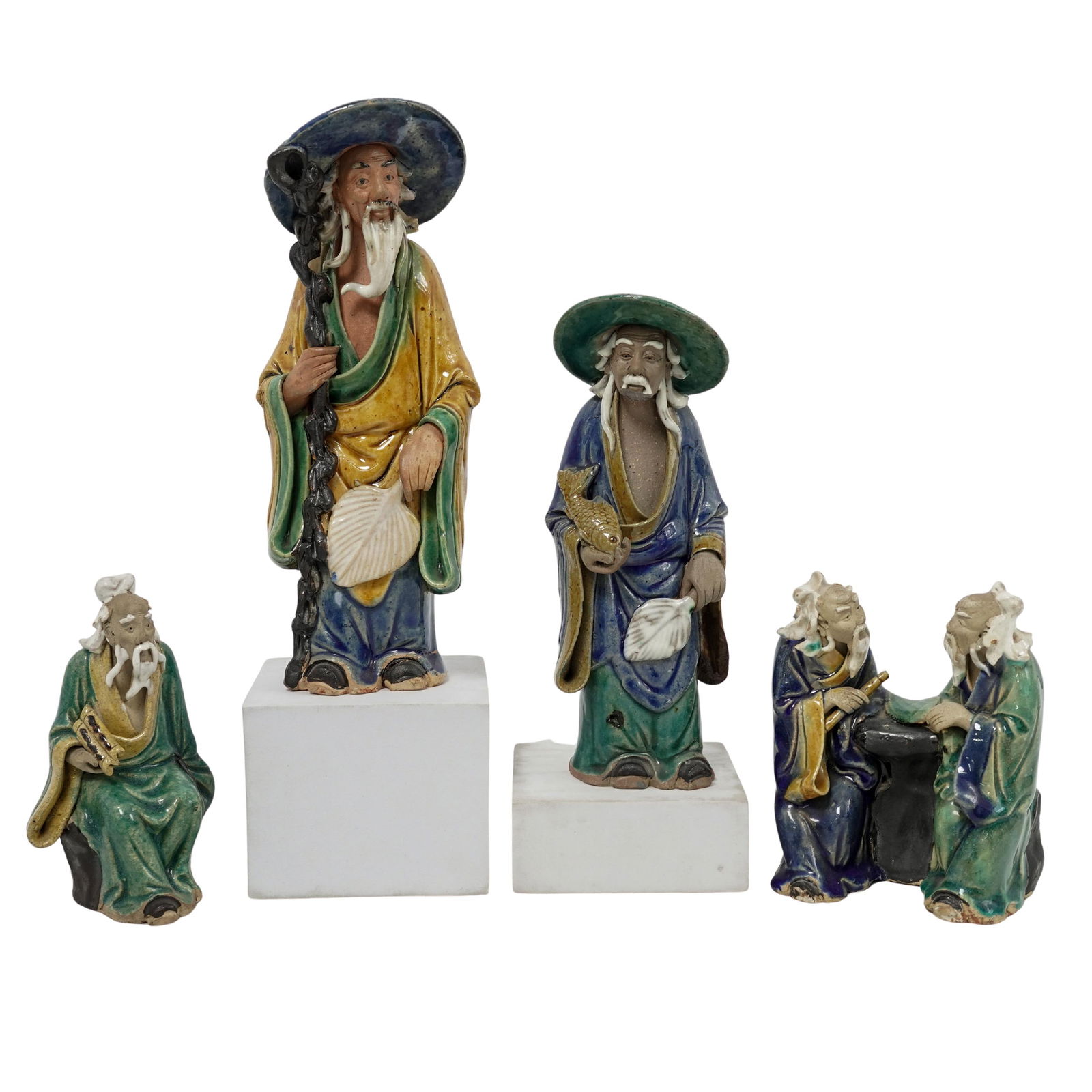 (4 Pc) Chinese Shiwan Mudmen Figurines: (4 Pc) Chinese Shiwan Mudmen FigurinesLate 19th century mid-20th century, ChineseShiwan mudmen, traditional Chinese glazed clay figures representing wise men, scholars or fisherman. These figurines ar