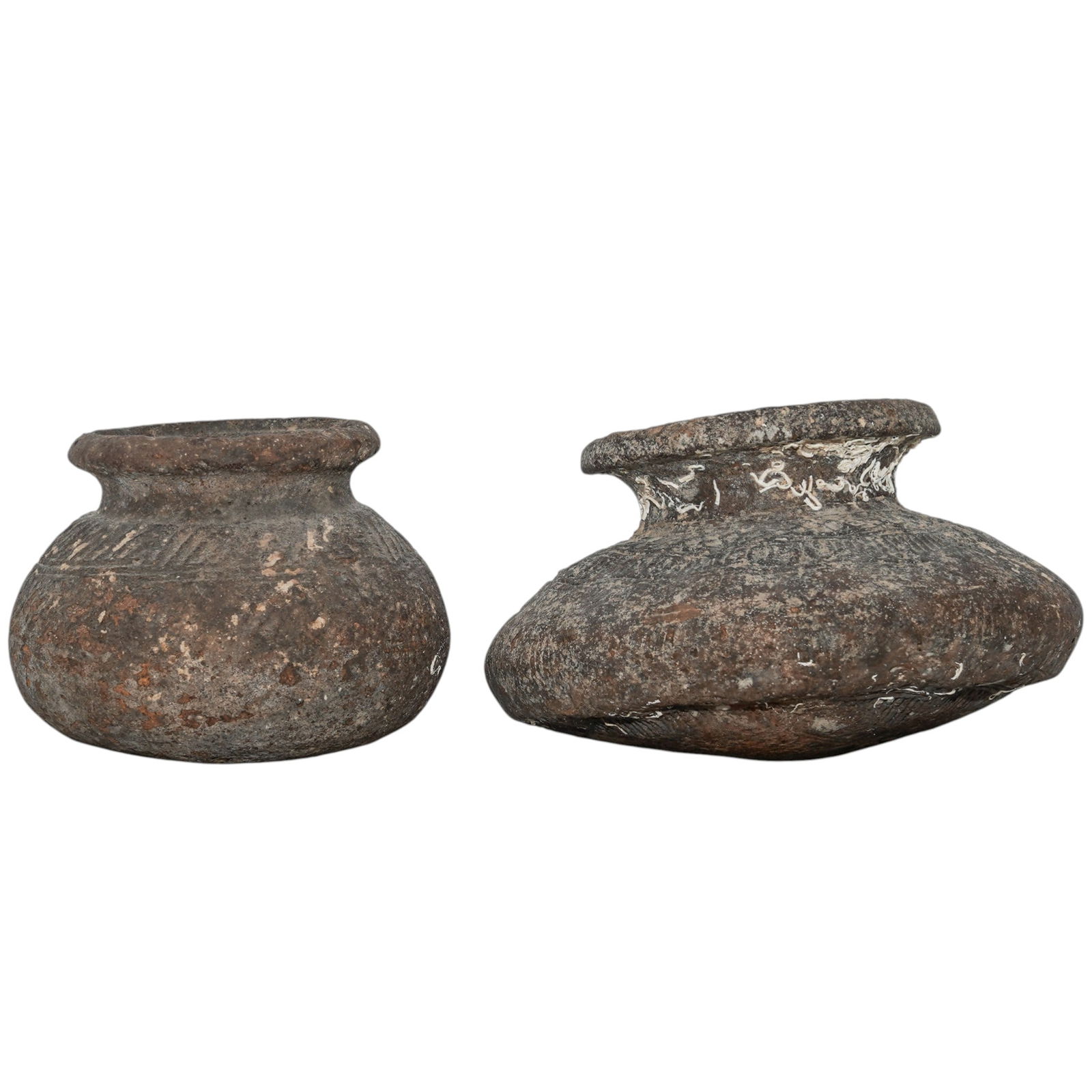(2 Pc) 12th C. Korean Koryo Pottery Vessels: (2 Pc) 12th C. Korean Koryo Pottery Vessels12th century, KoreanKorean Koryo/Goryeo Dynasty earthenware jars featuring incised geometric patterns and wide, rounded bodies with short necks and flared mo