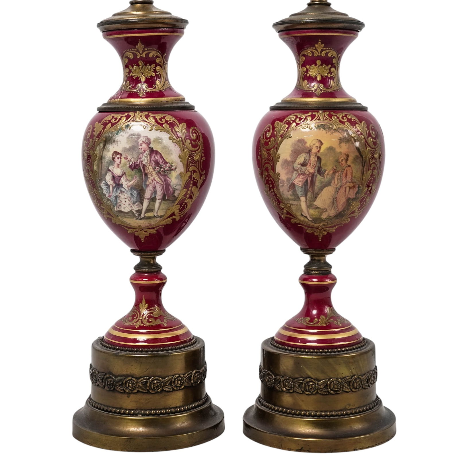 Pair of Sevres-Style Porcelain Urn-Shaped Table Lamps: Pair of Sevres-Style Porcelain Urn-Shaped Table Lamps1950s, FrenchThe lamps are made of hand-decorated porcelain with a distinctive burgundy red ground. They feature ornate gold inserts, raised gilt p