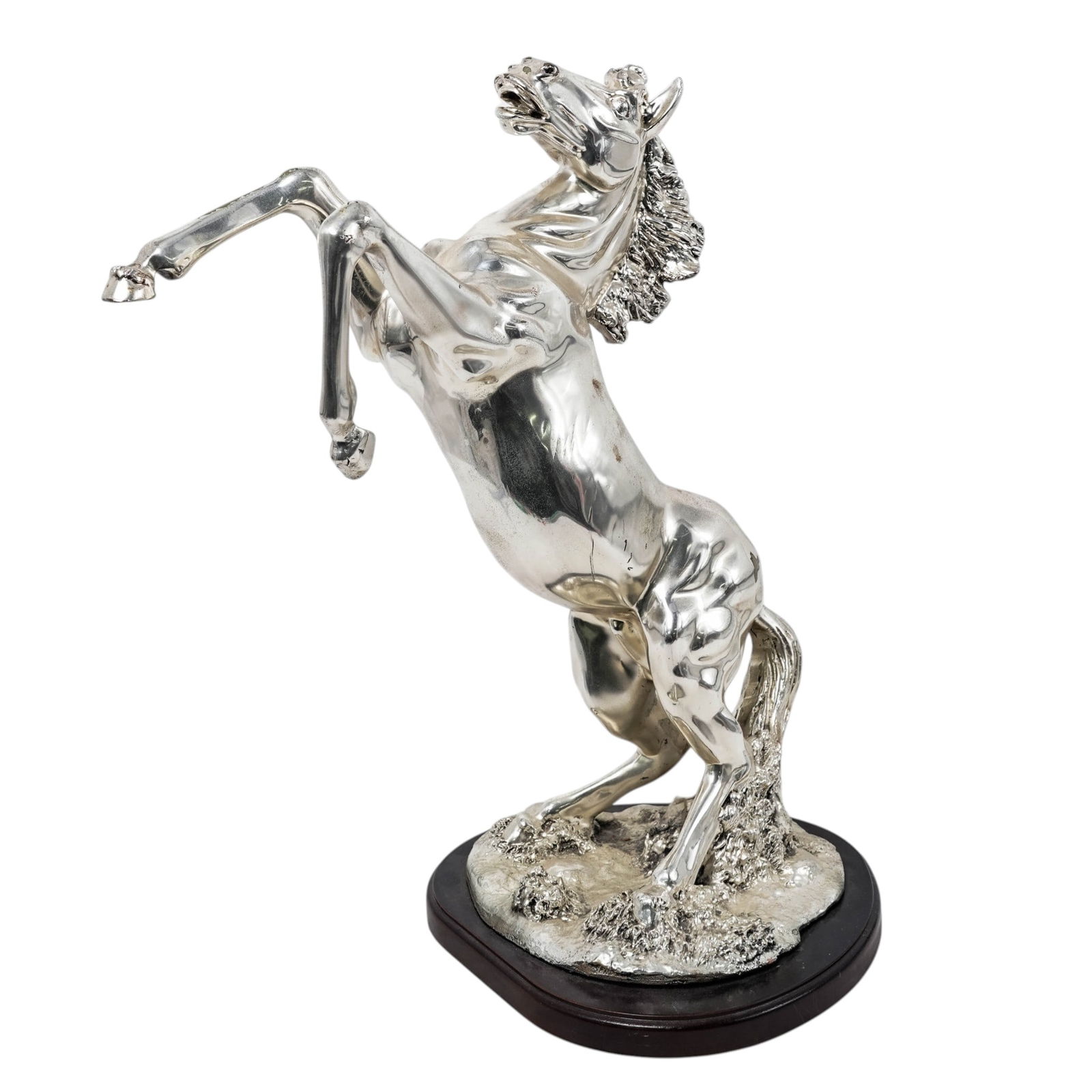 Silver Plated 'Rearing Horse' Sculpture: Silver Plated 'Rearing Horse' Sculpture 20th century, Continental A silver plated mixed metal sculpture depicting a rearing horse. On a carved wooden pedestal base. H: 21 1/2" x W: 18"
