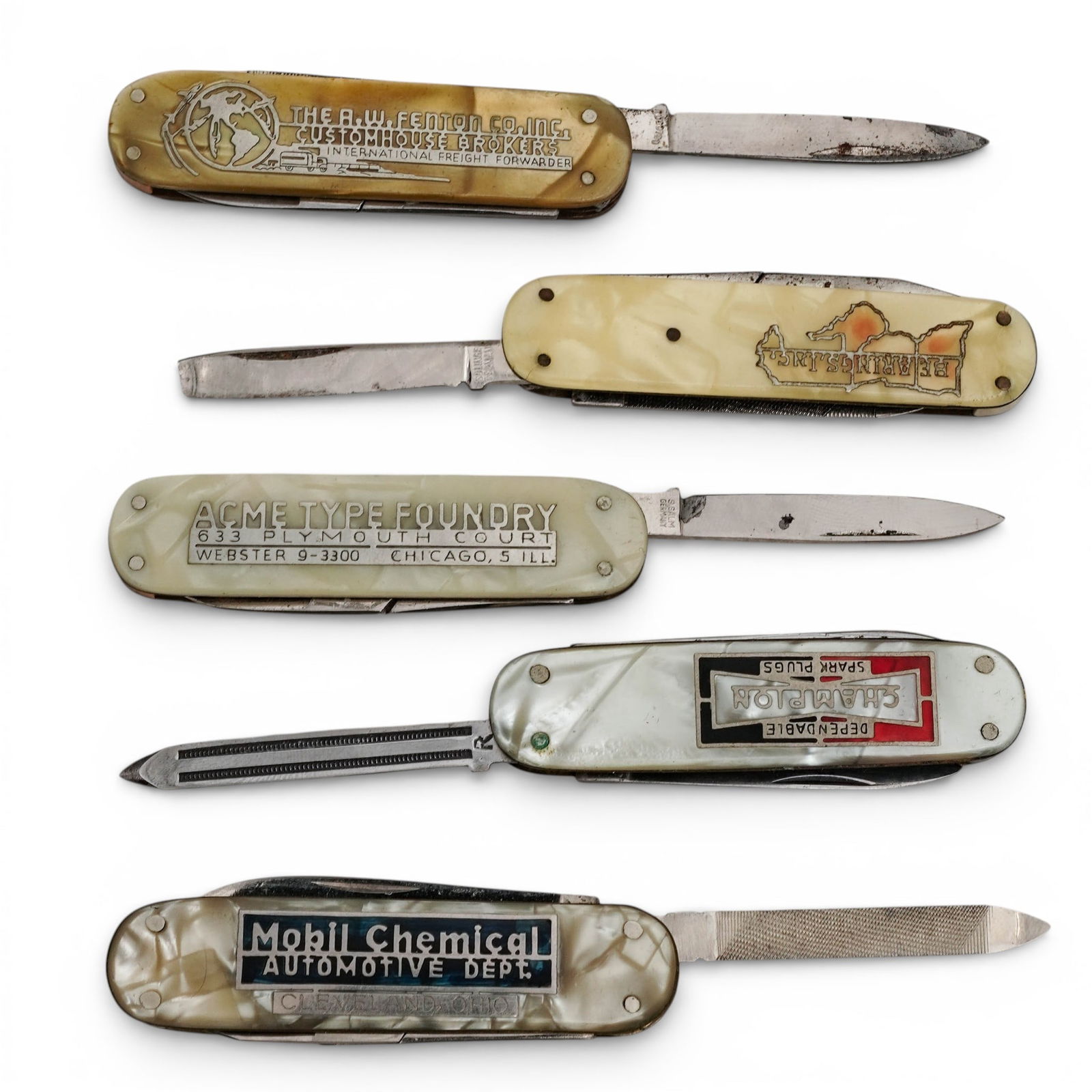 (5 Pc) Vintage Ad Multi-Tool Pocket Knives: (5 Pc) Vintage Ad Multi-Tool Pocket Knives circa 1930s, American Vintage multi-tool pocket knives with pearlescent bakelite handles featuring advertisements for various companies. Provenance: