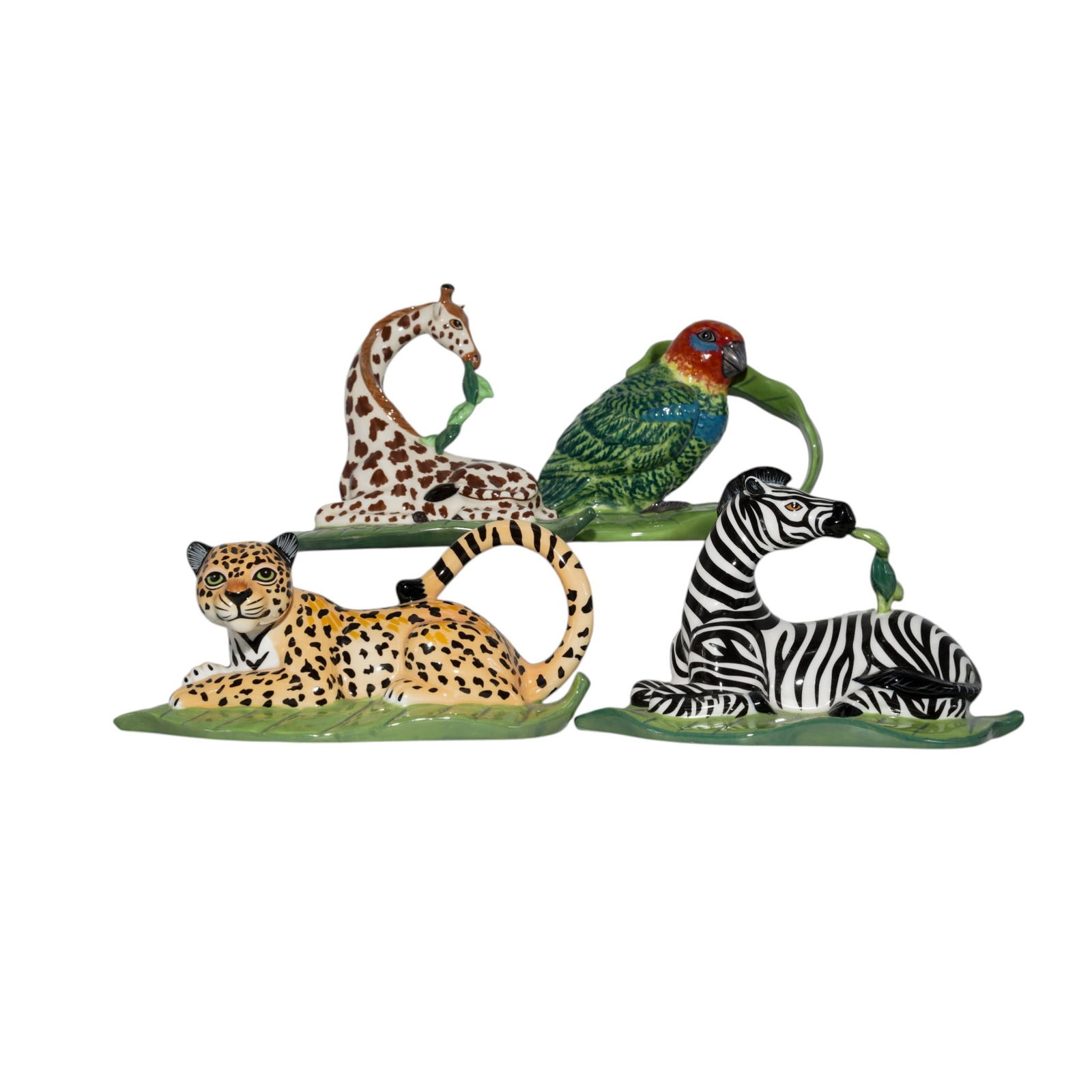(4 Pc) Lynn Chase 'Out of Africa' Ceramic Napkin Holders Set: (4 Pc) Lynn Chase 'Out of Africa' Ceramic Napkin Holders Set 2004, American. Four piece set of Lynn Chase 'Out of Africa' Ceramic Napkin Holders. Includes four napkin holders from the "Out Of Africa"