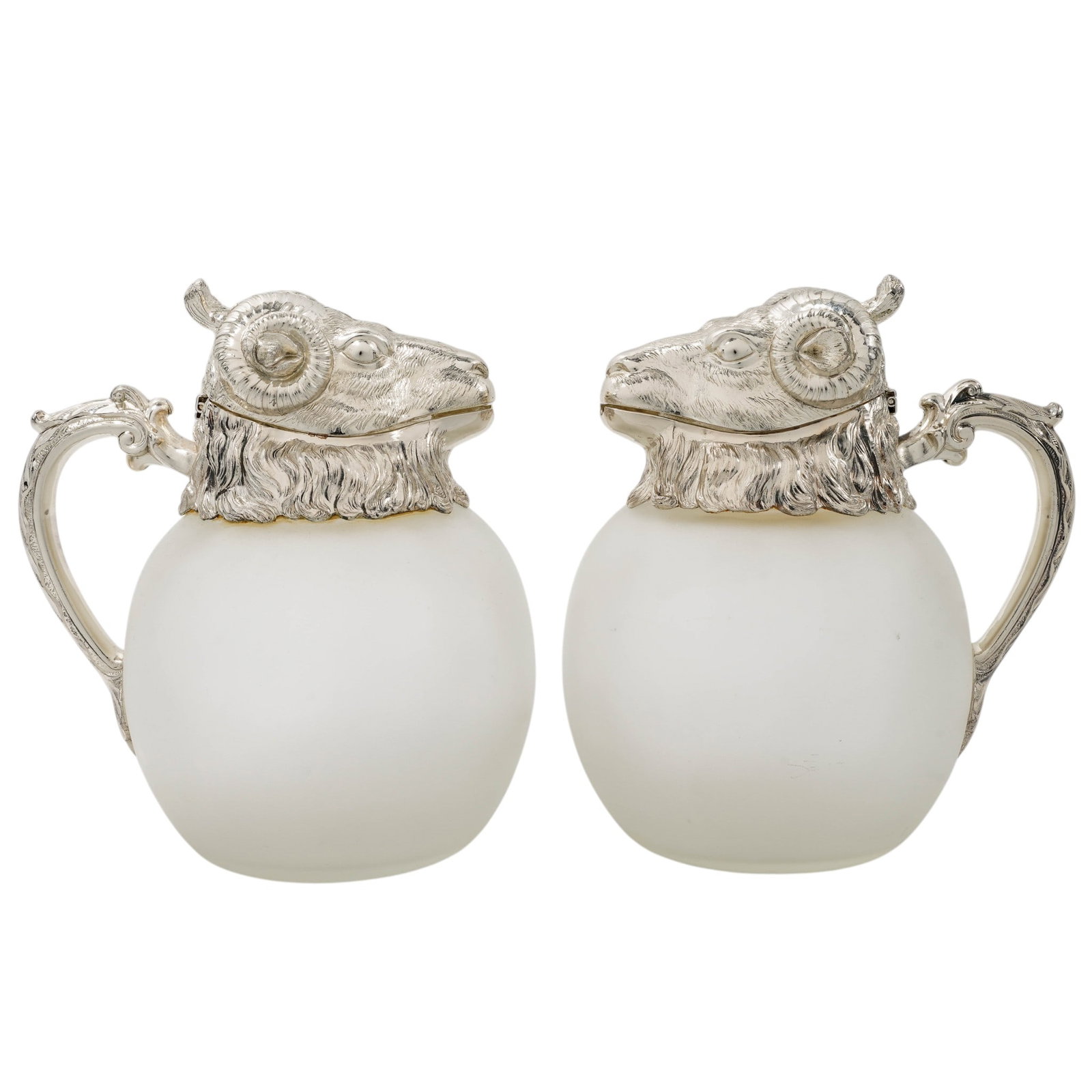 Pair Of Silver Plated & Glass Ram's Head Pitchers: Pair Of Silver Plated & Glass Ram's Head PitchersLate 20th Cent. Possible SpainThis pair of ram’s head Valenti style pitchers features a striking blend of Neoclassical and Mid 20th century modern ae