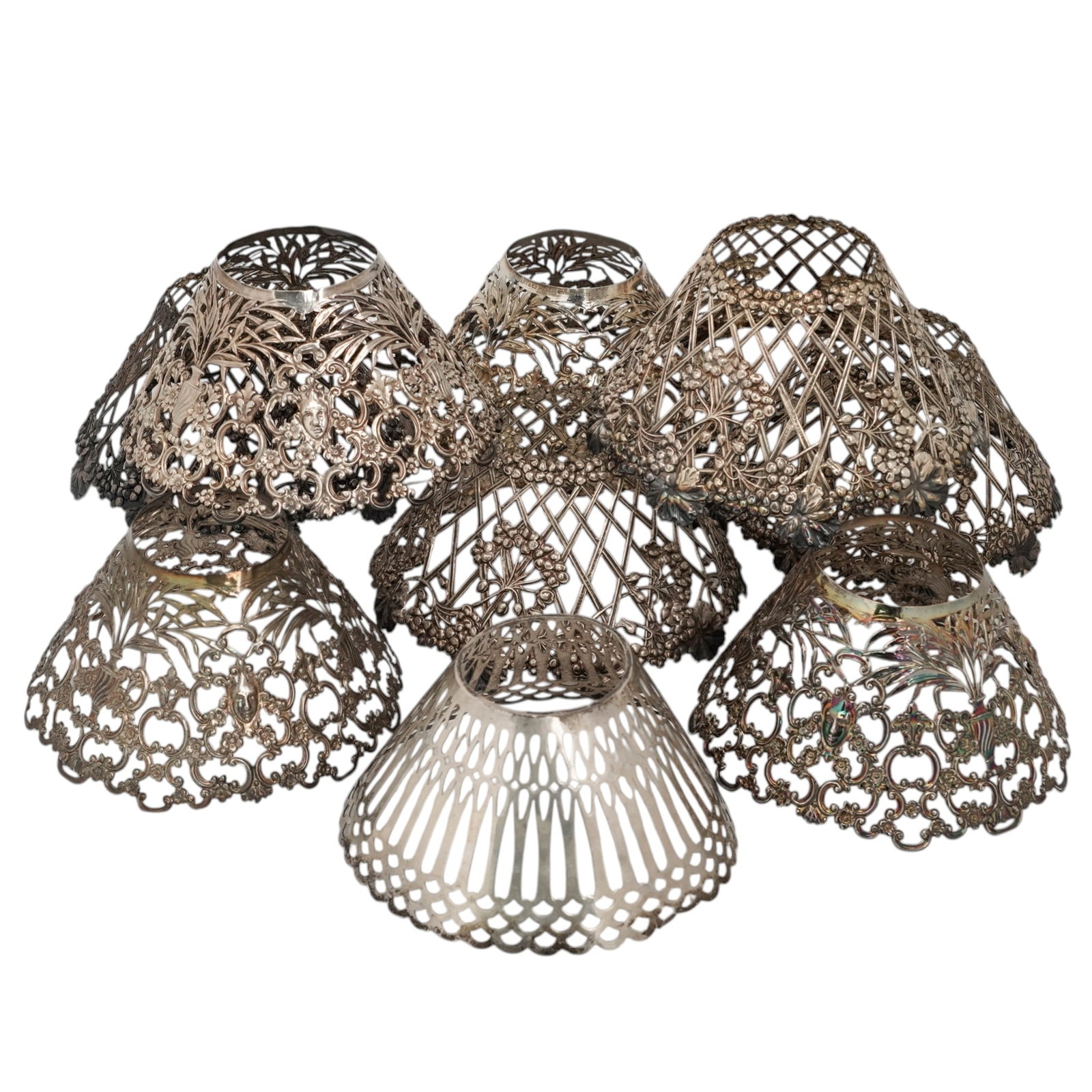 (9 Pc) Tiffany & Co. Sterling Openwork Candle Lamp Shades: (9 Pc) Tiffany & Co. Sterling Openwork Candle Lamp ShadesLate 19th-Early 20th c., USA(4) Tiffany & Co. sterling silver pierced candle shades featuring ornate pierced work, including scrolling floral d