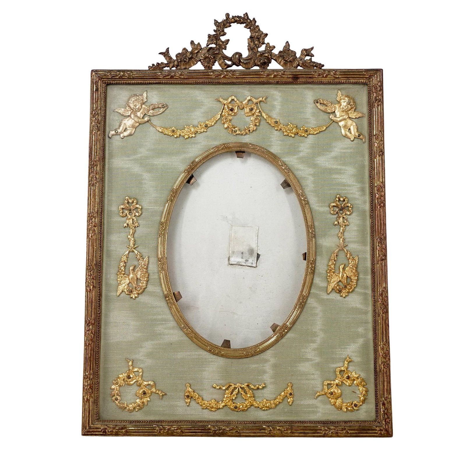 Antique French Ormolu Napoleon III Period Picture Frame: Antique French Ormolu Napoleon III Period Picture Frame1880-1900, FrenchIt is designed in the Louis XVI style, characterized by neoclassical motifs such as the ribbon bow crest and cherub accents. The