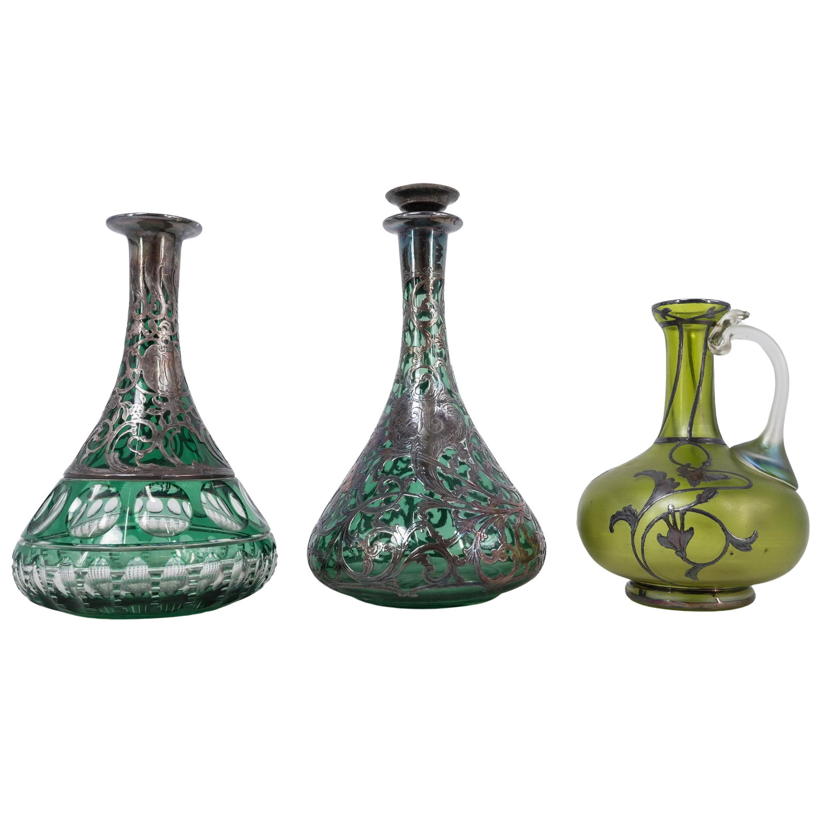(3 Pc) Alvin Sterling Silver Overlay Green Glass Bottles: (3 Pc) Alvin Sterling Silver Overlay Green Glass Bottlesc. 1900, USA(2) Antique Alvin Manufacturing Co. Art Nouveau green glass decanters overlaid in ornate scrolling floral and foliate sterling silve