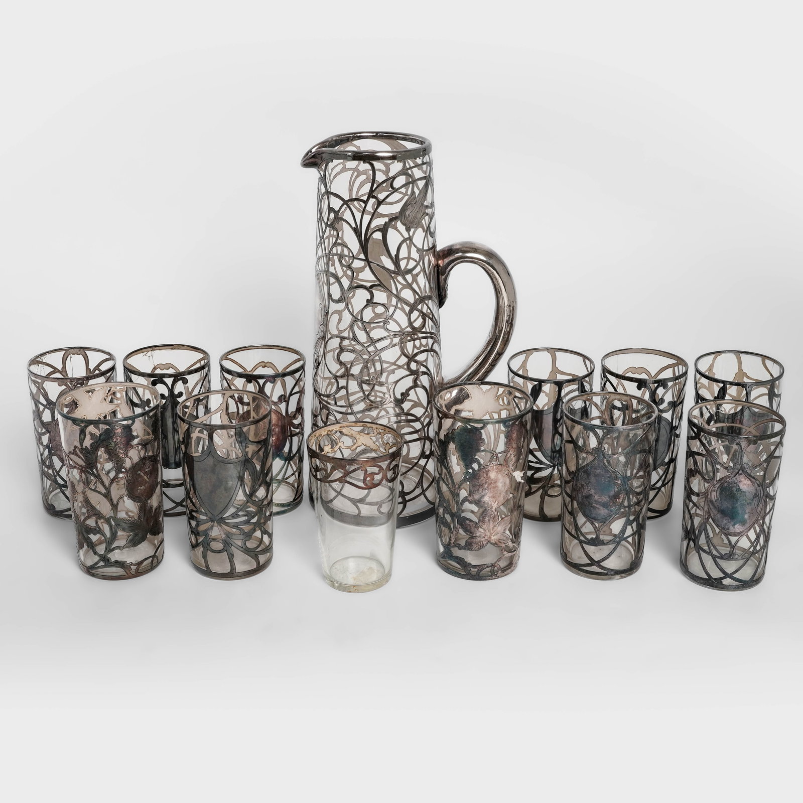 (13pc) Art Nouveau Sterling Silver Overlay Glass Pitcher & Glasses: (13pc) Art Nouveau Sterling Silver Overlay Glass Pitcher & GlassesLate 19th to early 20th Cent. AmericanThis 13-piece antique silver-overlay beverage group is a striking example of Art Nouveau craftsm