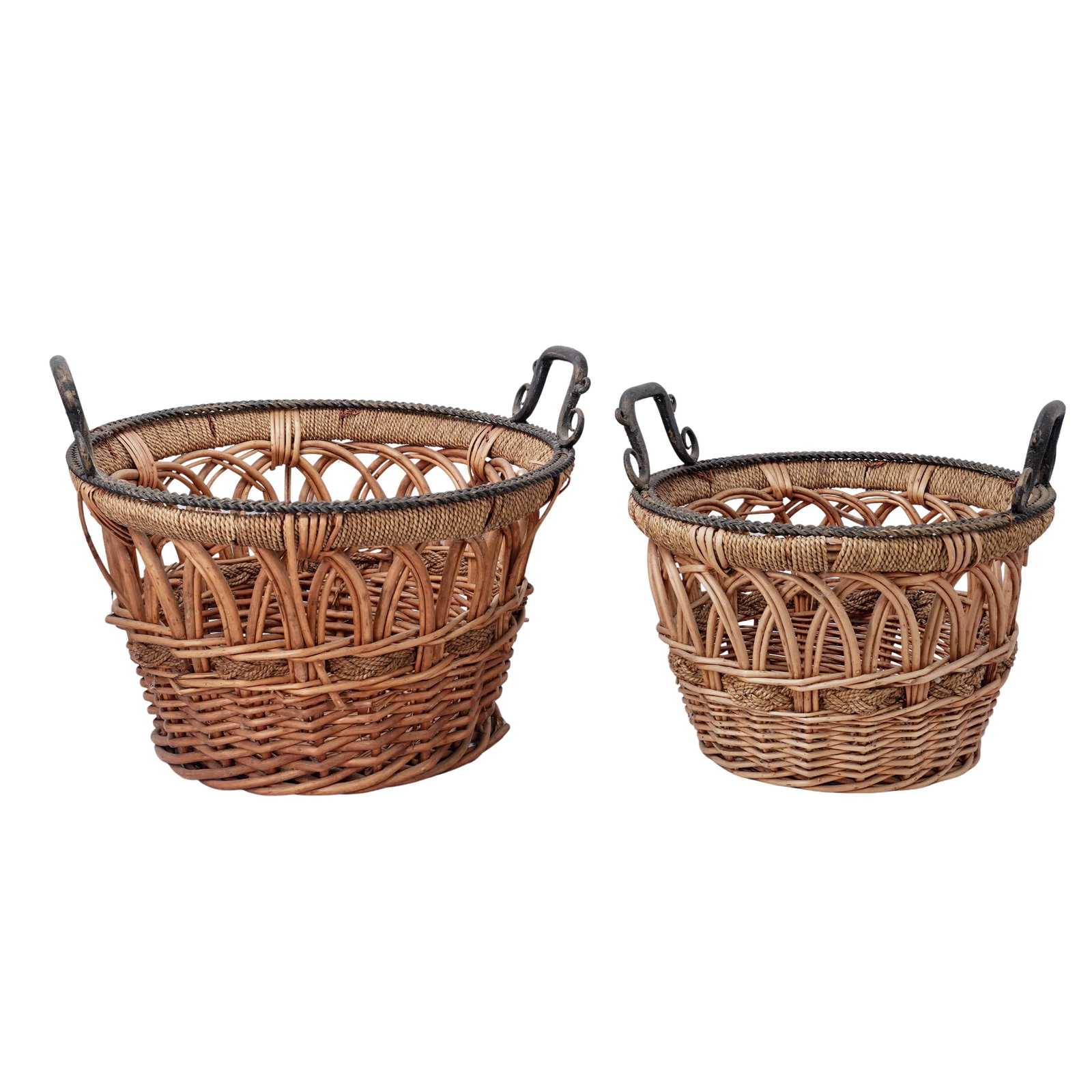 (2 pcs) Artisanal Woven Wicker Baskets: (2 pcs) Artisanal Woven Wicker Baskets20th centuryA set of two handcrafted artisanal woven wicker baskets, featuring an open work design with braided detail and decorative handles. Two sizes.H 15.25"