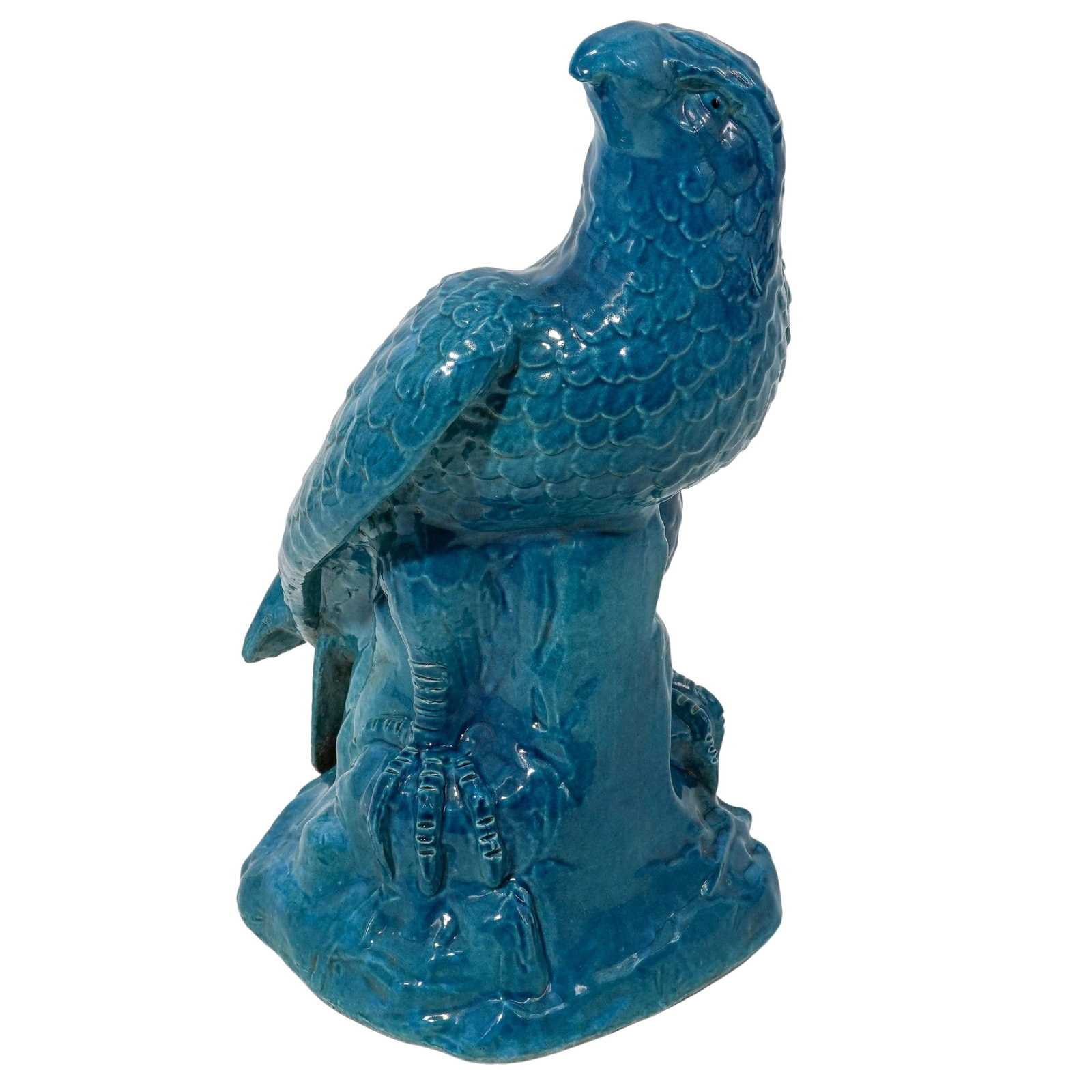 Vintage Blue Glazed Stoneware Eagle Figure: Vintage Blue Glazed Stoneware Eagle FigureMid 20th Cent.This blue-glazed stoneware eagle is depicted in a regal, alert posture with its head turned sharply to the side. It features deeply molded feath