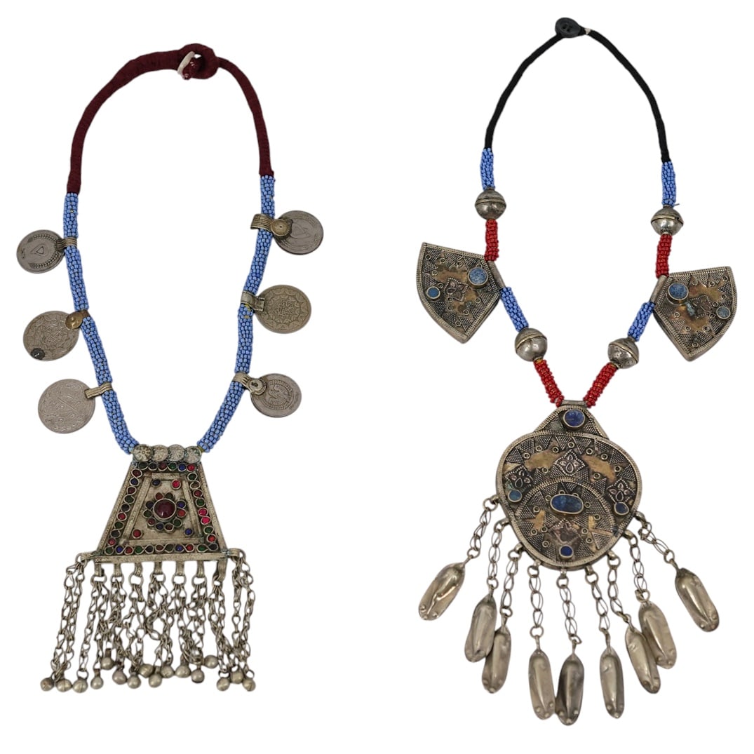 (2 Pc) Vintage Tribal Tibetan Amulet Pendant Necklaces: (2 Pc) Vintage Tribal Tibetan Amulet Pendant Necklaces 20th Century, Tibet (2 Pc) Two vintage tribal Tibetan amulet pendant necklaces, made of precious metals, natural stones and glass beads. L: 23"