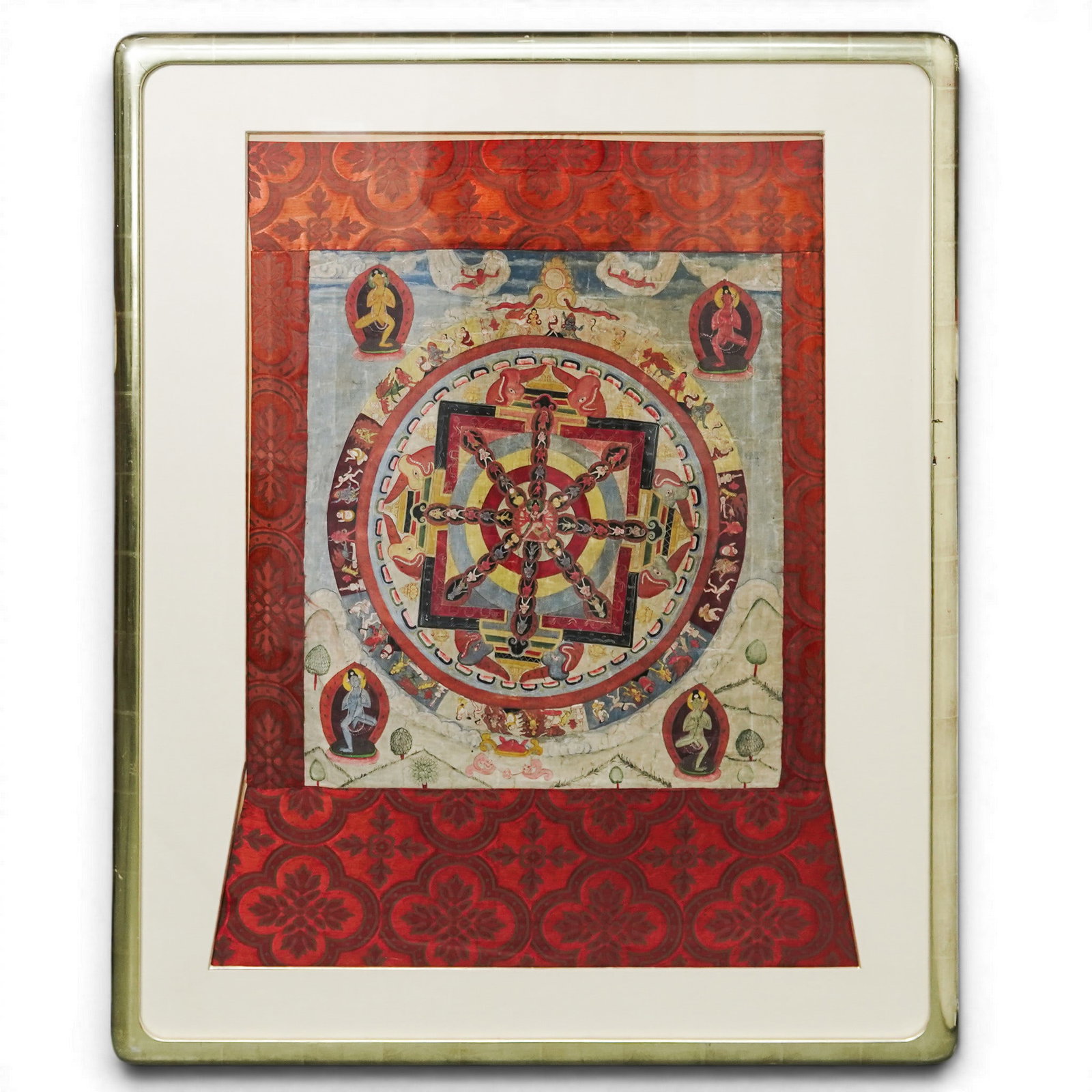 Antique Kalachakra Mandala Thangka, Cloth on Silk: Antique Kalachakra Mandala Thangka, Cloth on Silk Late 19th - Early 20th Century, Tibet A finely detailed Tibetan Kalachakra Mandala thangka rendered on cloth and mounted in an ornate silk brocade bor