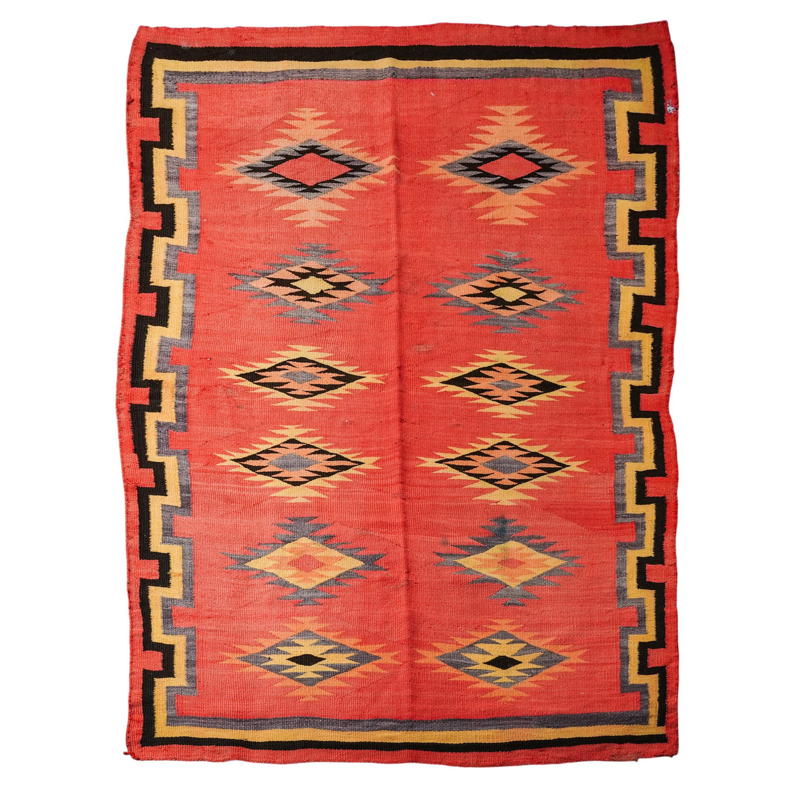 Vintage Navajo Transitional Woven Rug: Vintage Navajo Transitional Woven Rug 20th Century, USA Handwoven traditional Navajo patterned wool rug featuring a red field with repeating serrated diamond motifs and stepped geometric borders