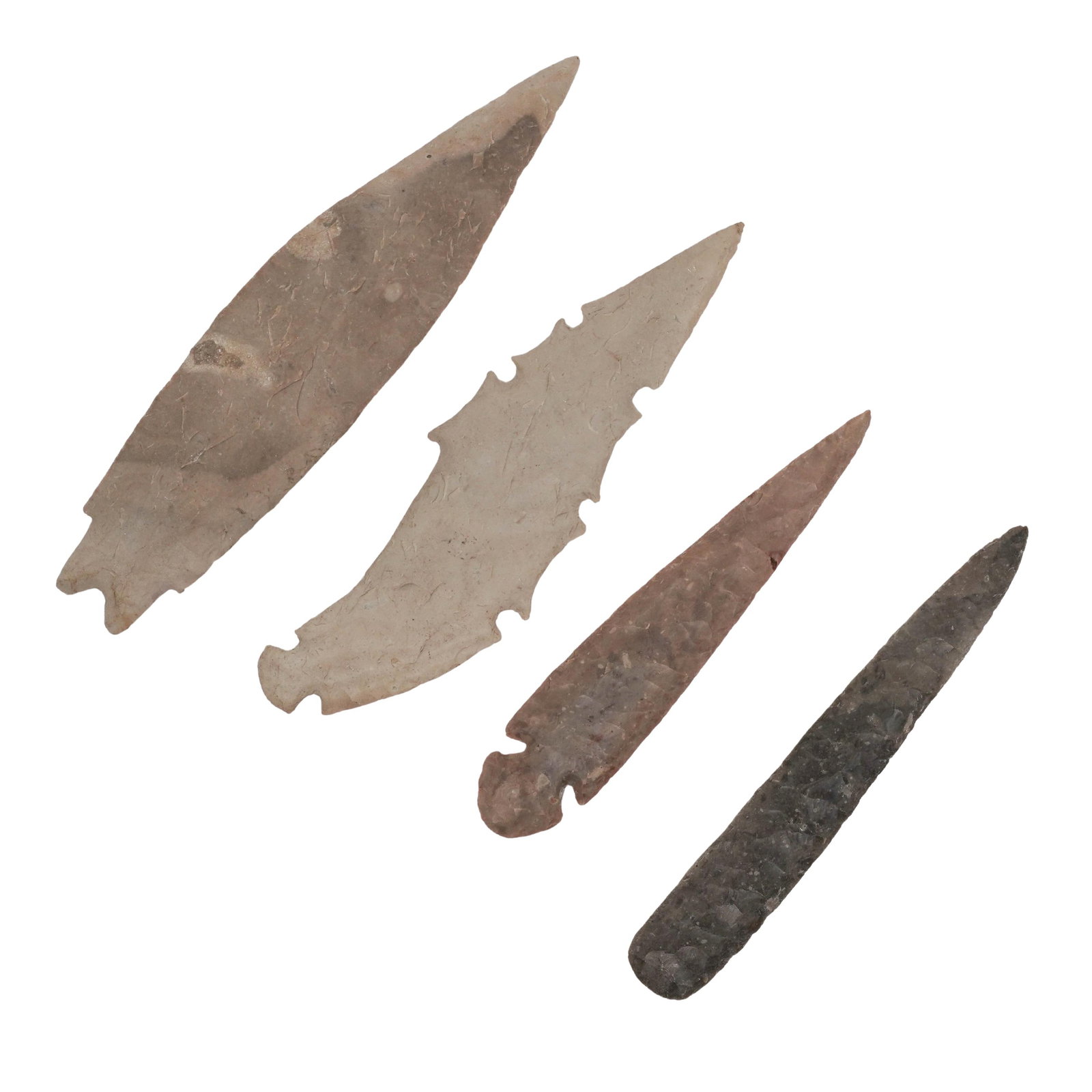 (4 Pc) Antique Grey Ghost Flinty Clovis Points: (4 Pc) Antique Grey Ghost Flinty Clovis Points North America Antique set of four flint Clovis points in a grey “ghost” tone, finely knapped with tapered forms and sharp symmetrical edges.