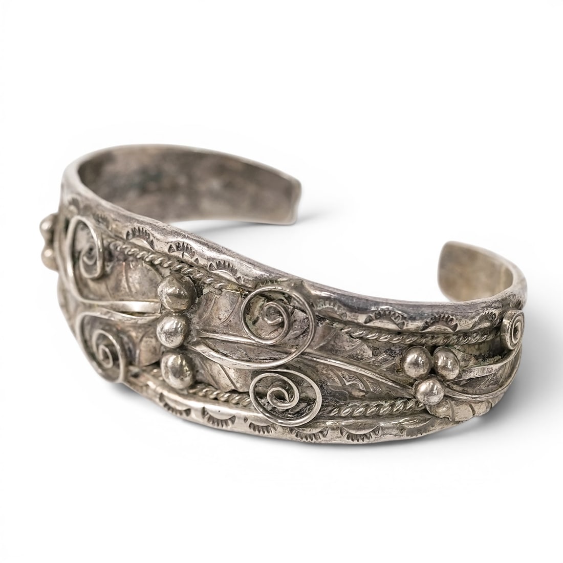Vintage Navajo Sterling Silver Scrollwork Cuff Bracelet: Vintage Navajo Sterling Silver Scrollwork Cuff Bracelet 1970s–1980s, USA Vintage Navajo sterling silver cuff bracelet with applied scrollwork, twisted rope accents, silver dropwork, and stamped fan